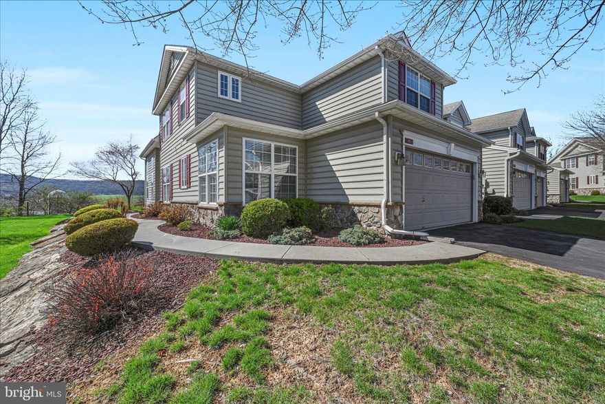 This could be the house that you have been looking for! This spacious floor plan features a stunning two-story family room with a gas fireplace and a highly desirable first-floor primary suite, complete with a picture window overlooking scenic countryside views. The primary bath includes double sinks, a linen closet, and beautiful ceramic tile finishes.
The thoughtfully designed kitchen is perfect for entertaining, offering recessed lighting and a full gourmet package. Enjoy upgraded flooring throughout the kitchen, dining room, and pantry, along with elegant wainscoting accents that add charm and character.
Step out onto the 14x8 deck just off the family room—perfect for relaxing or hosting—while enjoying one of the best lots in the community with plenty of space to play. The two-car garage offers both convenience and additional storage.
As an end unit, this home provides added privacy with peaceful, nature-filled surroundings. Upstairs, you’ll find two additional bedrooms, a full bath, and a versatile loft space ideal for a reading nook, media area, playroom, or home office.