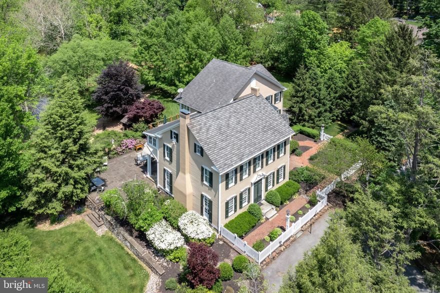 Experience the BEAUTY & CHARM of this one-of-kind, 19TH CENTURY GEORGIAN FARMHOUSE, perfectly located on nearly 6 LUSH ACRES. With TERRACED PATIOS and a CHARMING FOOTBRIDGE leading you over the beautifully meandering Monocacy Creek, the ROMANCE of this exceptional property is palpable. The original home dates back to the early 1800's and offers ELEGANT APPOINTMENTS, random-width BIRCH HARDWOOD FLOORS, and crown & dentil molding. The Sillivan & Chiles addition provides more modern touches including a GOURMET KITCHEN with Sub-Zero & Dacor appliances, warm and welcoming family spaces, plus an ELEVATOR leading to all 3 levels making this a home for all ages. WALLS OF WINDOWS & numerous french doors bring the outside in to create PRICELESS VIEWS. Enjoy a morning coffee while sitting on your WRAP-AROUND DECK overlooking WELL-MANICURED GARDENS, or throw a fishing line into the creek for some early evening RELAXATION. A SPECTACULAR PROPERTY like this only becomes available ONCE-IN-A-LIFETIME.