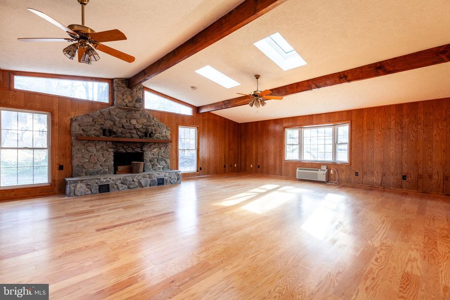 Original owner Colonial with huge permitted 33x16 Great Room (1985) with soaring ceilings and skylights framed by a wood burning fireplace and french doors out to a private patio and wooded yard. Freshly painted and new carpeting makes a move-in easy. Main level has living room,  office area that could be blown out to kitchen area, den, dining area, remodeled kitchen, and Great Room and main level mud room off garage.  Larger than most homes in Pointer Ridge at 2781 square feet. Parquet tile flooring under most carpeting. Upstairs has three large bedrooms and two full baths to include a huge primary with walk-in closet and  private bath. Nice hardscape and raised beds with nice private yard. Enjoy all the amenities of golf, swimming, walking trails,ice skating rinks, playgrounds, handicapped accessible playground, and more that Bowie and the excellent location offers. Minutes to NSA & Fort Meade & Beltway. Needs someone with vision and energy to make this a show stopper one of a kind to make easy sweat equity! New roof, hotwater heater, frig, washer, dryer and hvac. This home's location qualifies buyers for lender $10K credit plus possible $5K closing credit which might be a buy down on the interest rate!  Under contract 2/22 show for back ups only open house cancelled