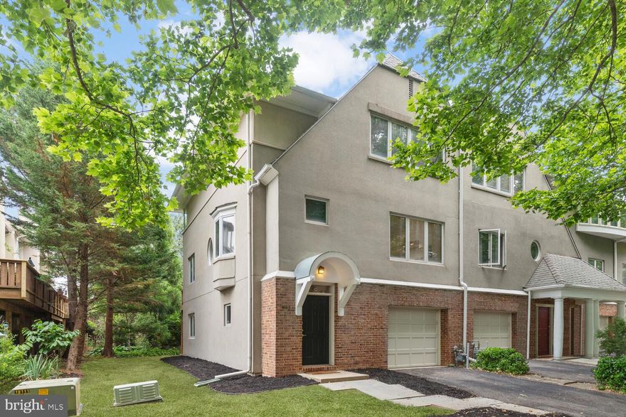 ***Offer Deadline: BEST & FINAL offers to be in by 12:00pm on Monday July 26th*** This gorgeous end-unit townhome is located in the sought-after Villages at Homeland community, offering four bedrooms, sun-filled windows, a neutral color theme, and fantastic updates throughout. As you enter the townhome, you are greeted by a welcoming foyer on the lower level with access to the garage and a coat closet for convenience. Additionally, the lower level features a fourth bedroom suite, with a cozy wood-burning fireplace, a laundry closet, access to the rear patio, and a luxurious newly renovated bathroom that boasts a glass-enclosed walk-in tile shower and a Bluetooth exhaust fan, adding a touch of modernity. Moving upstairs to the main level, you will find beautifully refinished hardwood floors that add elegance to the living space. The living room is adorned with new custom built-in shelving and another wood-burning fireplace, creating a cozy and inviting atmosphere. Glass doors in the living room lead to a rear deck that overlooks the serene woods, providing a perfect space to relax and unwind.
Prepare your favorite meals in the exquisite kitchen that was remodeled in 2018 and boasts quartz countertops, accent backsplash, 42” soft-close cabinets with a pantry, large center island with breakfast bar, and premier stainless steel appliances with gas cooking. The kitchen seamlessly flows into the dining room, making it easy to entertain guests. Oversized windows in the kitchen and a bay window in the dining room bring in an abundance of natural light.  A half bathroom completes the main level. Heading upstairs, the primary bedroom suite awaits with a walk-in closet and a private bathroom. The upper level also features two additional spacious bedrooms and a second fully renovated bathroom with a linen closet. Other recent upgrades include a new roof in 2019, new water heater in 2019, new garage door in 2022, Lutron dimmable recessed lighting and more. Enjoy the community’s excellent amenities, including security gate, an outdoor pool, and a clubhouse that features a fitness center and party room for social gatherings.