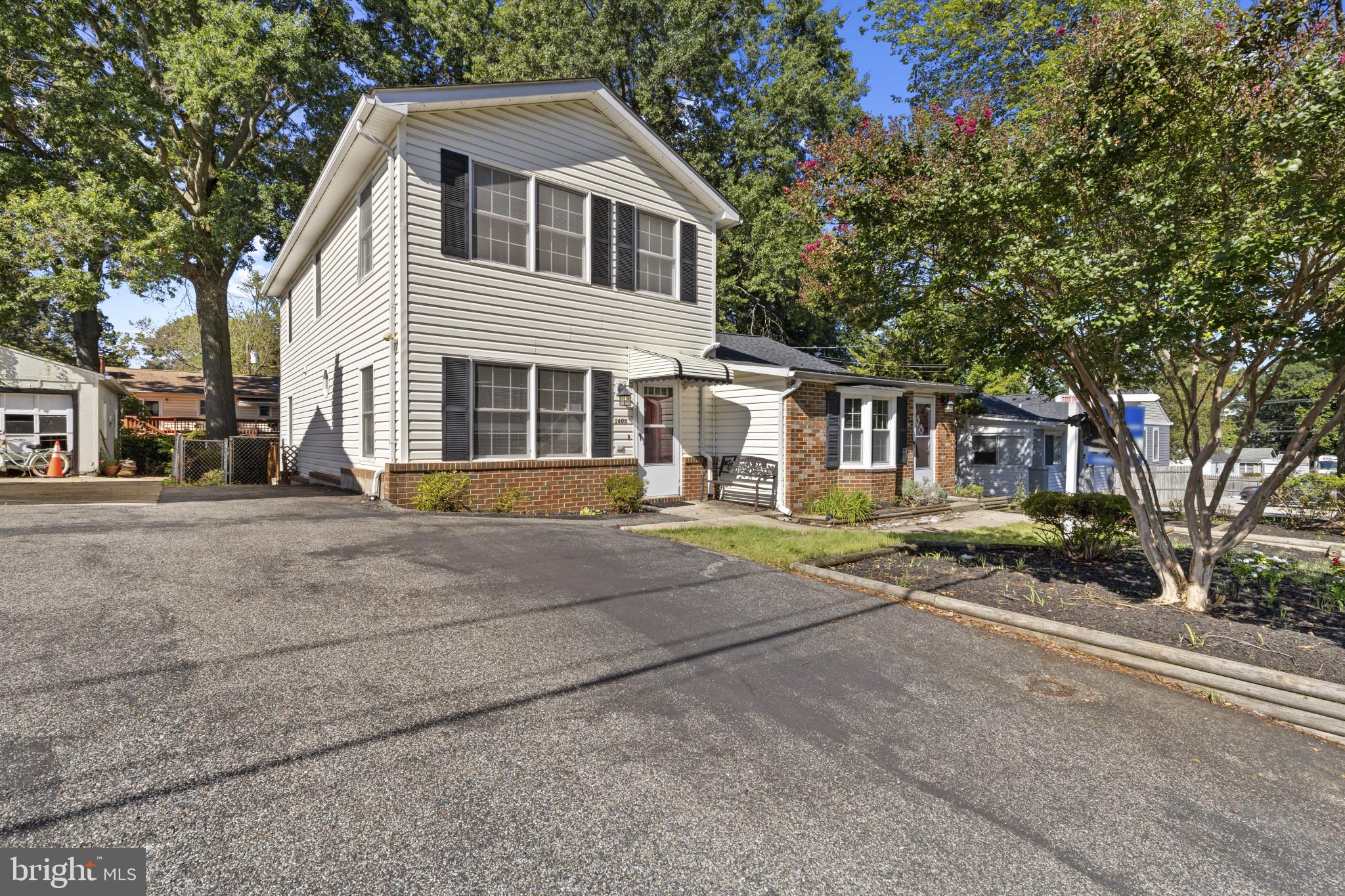 Rare-find, unique, single-family home approximately 2,250 square feet of living space! Absolutely perfect for the in-laws, older children, roommate situation and/or multigenerational family! (One side is the original rancher and the other connected side is a newer colonial). This inviting 4-bedroom, 2.5 bath home offers fresh, neutral paint throughout! Brand-new carpet! Updated roof! Updates in bathrooms! Spacious living room with lots of natural light! Large kitchen with lots of cabinet space and some updated appliances! Updated half bath! Oversized primary bedroom with expansive walk-in closet! Additional upstairs bedroom with lots of space! Full bath on upper level! One-level side has an eat-in kitchen area with additional cabinets! Spacious family room! Two additional bedrooms and another full bath! The fenced, level lot boasts two decks, trees, and storage shed - perfect for outdoor dining and relaxation! Water privileged community! Must see to appreciate! Easy access to major highways and shopping! A must see!