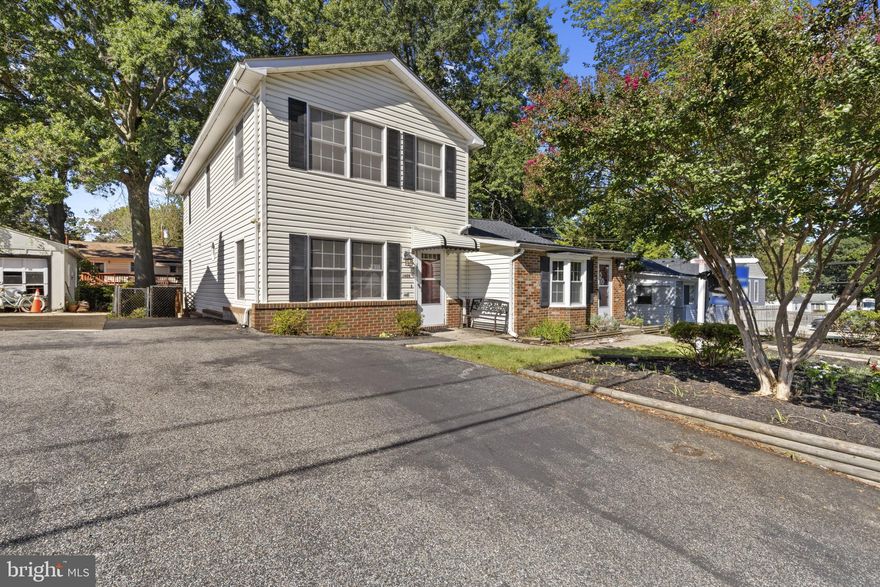 Rare-find, unique, single-family home approximately 2,250 square feet of living space! Absolutely perfect for the in-laws, older children, roommate situation and/or multigenerational family! (One side is the original rancher and the other connected side is a newer colonial).  This inviting 4-bedroom, 2.5 bath home offers fresh, neutral paint throughout! Brand-new carpet! Updated roof! Updates in bathrooms! Spacious living room with lots of natural light! Large kitchen with lots of cabinet space and some updated appliances! Updated half bath! Oversized primary bedroom with expansive walk-in closet! Additional upstairs bedroom with lots of space! Full bath on upper level! One-level side has an eat-in kitchen area with additional cabinets! Spacious family room! Two additional bedrooms and another full bath! The fenced, level lot boasts two decks, trees, and storage shed - perfect for outdoor dining and relaxation! Water privileged community! Must see to appreciate! Easy access to major highways and shopping! A must see! PRICE REDUCED TO SELL! Lots of square footage for the $$$.