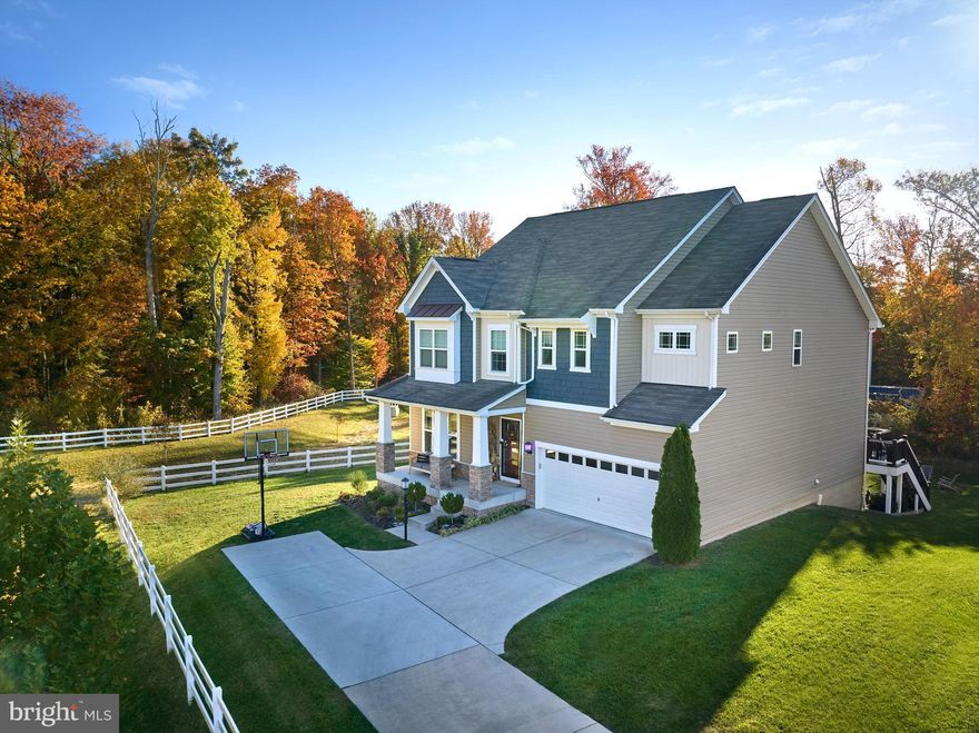 Beautifully maintained home in the Hamilton Reserve community, offering a rare blend of privacy, flexibility, and thoughtful upgrades. Backing to woods with only one neighbor, the property provides a peaceful setting while remaining near everyday conveniences.

The open main level features a spacious kitchen with island seating, large pantry, and eat-in area that flows naturally into the living room, ideal for both daily living and entertaining. A dedicated main-level office adds work-from-home flexibility.

Upstairs includes a generous primary suite with sitting area and open spacious closet, along with additional bedrooms and upper-level laundry. The finished lower level is a standout: featuring a media area, gym, play space, utility room and a two-person sauna, creating a true extension of the living space.

Outdoor highlights include a deck and patio overlooking wooded views, offering privacy rarely found in the neighborhood. Additional features include an EV charging station, upgraded lighting, and smart home touches. Move-in ready.