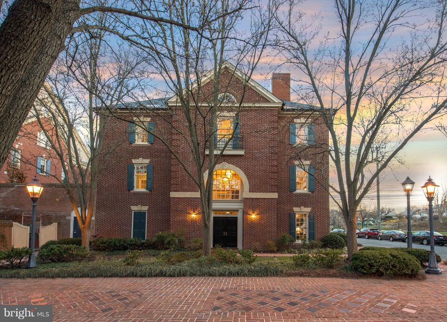 Rarely available Harborside end unit on corner lot feels like single-family home! Proper brick colonial w/luxe details on 4 levels: HW floors, dentil molding, paneled archways, 2 Swarovski crystal chandeliers & gas FP in LR, MBR & FR. 4 beds, 3.5 baths w/enclosed, renovated KIT & brick patio. Gated parking access from foyer. Situated on quiet block w/water views. Minutes walk to shop/dine/play.