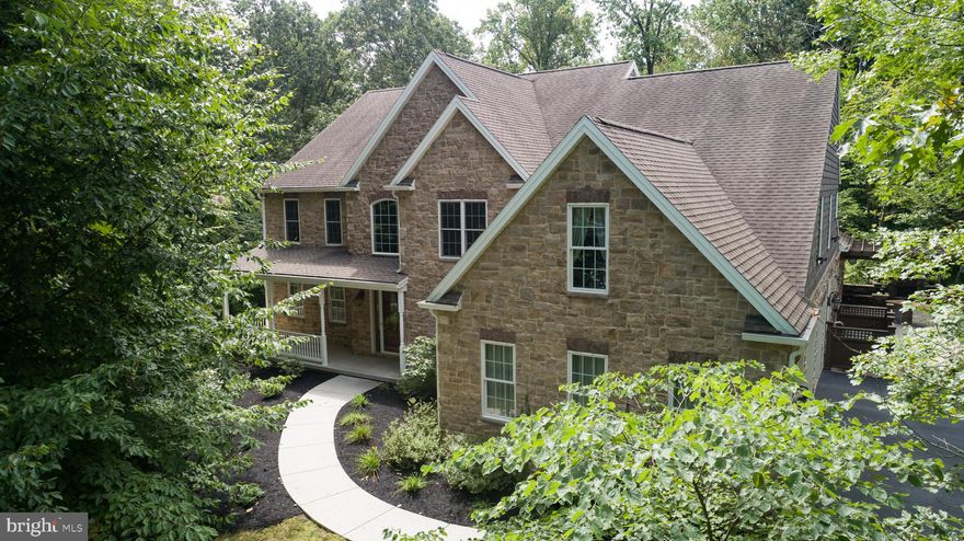 Step into this spectacular custom Carricato home and instantly be amazed by all the coveted upgrades and finishes you would expect in a luxury home. The covered front porch welcomes you into a grand foyer with newly refinished hardwood floors leading you to the heart of the home. The gourmet kitchen includes an expansive center island w/seating, providing an abundance of counterspace and storage. A walk-in pantry adds to the already plentiful kitchen storage. The professional-grade SS appliances will excite any home chef and the added water line hook-up to the coffee maker is sure to please the coffee lover! Adjacent to the kitchen is a spacious breakfast room for the largest of family gatherings. Enter from the garage to a spacious mud room and walk-in closet. Currently used as an office, a set of French doors opens to a room w/stone fireplace and bow window. Enjoy cozy evenings in the family room by the stone fireplace while watching tv on the remote-control 92-inch projector screen. Use the remote to draw the blinds from the couch! A set of French doors lead you to a formal living or music room w/crown molding and wainscoting.  Across the foyer find another versatile room which is currently being used as a craft room but would be perfect for a virtual or home school room. Finishing the main level, you will find a massive sunroom, w/vaulted ceiling & three walls of sliding windows.  A dehumidifying system allows you to enjoy the hot tub year-round.  Also featuring, perfect for the grill-master, a state-of-the-art outdoor kitchen including a sink, 2 refrigerator drawers and a warming drawer. Sliding doors take you outside to the extensive paver patio with granite peninsula for outdoor dining, a gas fireplace with water feature and a built-in firepit table w/bench seating. All situated below a 20x20 pergola. Upstairs, is an owner's suite with a walk-in closet that will take your breath away.  The spacious bath includes a jetted tub, oversized tile shower with double shower heads and heated marble floor. The extra-wide hallway with hardwood floors takes you to the additional 4 bedrooms all w/en-suite baths and walk-in closets. The LL is an entertainer's dream offering over 1800 fin sq/ft of additional living space. Host movie night in the home theatre room w/92-inch screen and 8 leather power reclining seats complete w/cup holders and snack trays. After the movie, take the party to the bar area to enjoy a cocktail and a game of pool. Completing the basement is a massive open room ideal for more table games and a seating area in front of the stone fireplace. Sliding doors will take you to the yard perfect for added outdoor living space or even a swimming pool. House is wired to include a home audio system, full house home intercom system, home security cameras and is home automation-ready with pre-installed switches. Home audio and security cameras can be accessed by any of the eleven iPads located throughout the home. Situated at the end of a cul-de-sac in a private wooded setting, this home is close to Hershey and Lancaster and the charming town of Mt. Gretna is only a bike ride away on the Lebanon Valley Rail Trail. Seller is offering a one-year home warranty for peace of mind.