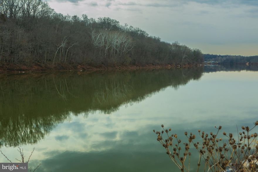 Rare opportunity to own a 5.5 acre wooded   Potomac Riverfront lot in desirable  gated  Crossings on the Potomac residential community,  Build your dream house and bring your boat. . Swim, fish, boat from your back yard.  The lot  has several hundred feet of direct frontage on the Potomac River.  Peaceful neighborhood of large lot sizes. 
Beautiful river views up and down the Potomac. The Crossings on the Potomac project contains private asphalt streets and  a private  large boat marina with a boat ramp and seasonal dock slips.  Enjoy the navigable deep water stretch of the  Potomac River .  Enjoy the natural beauty of this exclusive community. 
Convenient location with easy access close to highway I-81.  Minutes to MARC Commuter Train to DC in Martinsburg. Minutes to Martinsburg,  Maryland Line   and nearby Virginia line. 
Go to documents for covenants,  plat and additional information. 
On line review the  Crossings on the Potomac Property Owners Association site