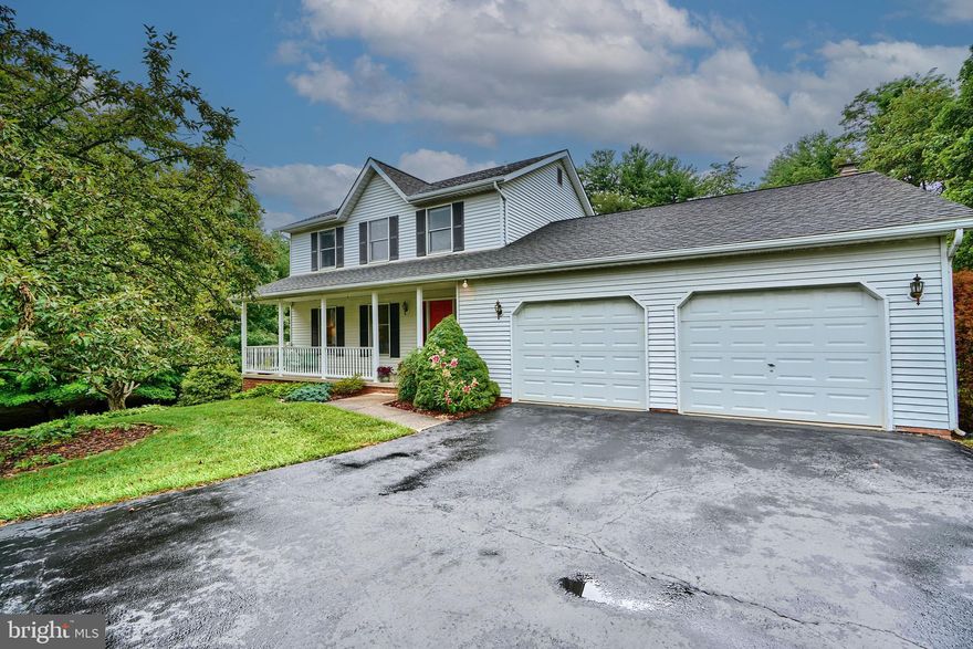 HEREFORD ZONE!  Less than 3 miles from I 83
 The original owners have meticulously maintained this custom-built home.  The flowing first-floor features gleaming Brazilian Cherry wood floors throughout, with a banister handrail made to match. The living and dining rooms are spacious and bright. The kitchen was remodeled with a colorful glass tile backsplash and custom cherry cabinets with undermount lighting. The wall oven and microwave with a convection feature are Kitchen Aid. The DW is BOSCH.  A spacious granite island and bar with a Viking cooktop and downdraft, slow-close drawers, and cookbook cabinets make this a well-thought-out kitchen.   A window seat with storage below enhances the breakfast area.
A built-in desk with a granite top, and cherry cabinets is a great addition to the kitchen/family area.  The family room has a wood-burning fireplace with a mantle above, and French doors to the rear deck. The laundry room accesses the spacious 2-car garage. Upstairs you will find 3 spacious rooms and plenty of closet space. The Primary suite faces the front and has a nice-sized walk-in closet. The primary bath is bright with a front-facing window and it has a shower tub combo. HVAC &WELL PUMP 2022, Washing machine 2018, and bedroom carpet new in 2019.