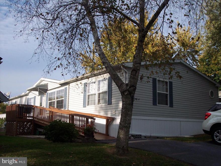 Spacious 2001 28x64 Rebman Shadowridge. Move in ready! Newer carpet, vinyl floor in foyer, & master bath & newer furnace in 2011 are just a few of the many upgrades. Stone fireplace w-built-in cabinets in living room. Fireplace is wood burning & perfect for those cold nights. HMS warranty included.