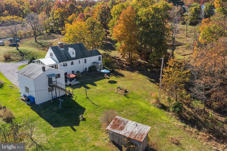 20 Unrestricted acres just about a mile off Rte 522. Ideal location about 30 minutes from Winchester VA. Mostly wooded property with 40 x 50 pole building, 26 x 27 metal shed and detached 2 car garage with loft space. Pear, peach, apple and quince trees along with a grapevine and blueberry, raspberry and blackberry bushes. Home is a 4 bedroom and 1 1/2 bath Cape Cod with a full walkout basement. And a nice sun porch with mountain views. Great place to have your morning coffee. 2 bedrooms on main level and 2 upstairs. Wood burning FP on main level and a new woodstove and flue liner in basement. HWH and Pressure Tank less than 2 years old. Replacement vinyl windows on main and upper levels. If you're looking for some acreage to enjoy the outdoors, this is it.