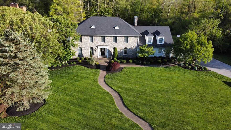 Welcome to 819 Armistead Street.   Located in the prestigious Meadow Branch neighborhood, this Colonial Revival style home has a nice Georgian flair to it.   Marble floors welcome you into a large foyer.  To your left is a living room with arched windows and wood floors.  To your right, you'll find the dining room with arched windows, wood floors, and the original chandelier and toile wall paper chosen by the original owner.  Step into the beautiful, updated kitchen, with designer light fittings, hardware and cabinets, quartz countertops, wood floors, a beautiful island and a  gas fireplace  for those cold winter days.  Off your kitchen is a large laundry room with built in cabinets, marble counters and sink.   Also on the main floor is a powder room for your guests, a great room with cathedral ceilings and a large, stone wood burning fireplace.  Custom drapes flank the windows overlooking either the private deck or the pool and pool house.  Off the great room is a fabulous den or guest bedroom, full bath and walk in closet.  Beneath the great room is a storage room perfect for the mower and work shop.    Upstairs, you'll find a primary suite with a beautiful bathroom with separate tub and shower, quartz countertops, and two separate closets. You'll also find the hall bath, and 3 additional bedrooms, one with a large bonus room attached.  Note the cute dormers over the garage!  Downstairs, you'll find the carpeted basement, an exercise room with a concrete floor and a utility room.  Extensive hardscaping and landscaping provide multiple options for relaxation.  New roof in 2016.  2nd floor HVAC system new in 2023.  Exterior is a beautiful stone complimented by James Hardie siding in Arctic White.  3 car garage.  Professional photos coming soon.  Owner is a licensed RE agent.