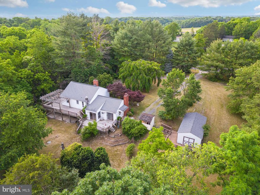 Welcome to 2016 Rivermont Drive, Front Royal VA 22630! This single-family home is a hidden gem nestled on 2.1 private wooded acres with no HOA. With a little love and restoration, this split-level home can be brought back to its original beauty!  Boasting 1,291 square feet of living space, this home features 3 bedrooms and 1.5 bathrooms. Step inside to discover hardwood floors, paneled walls, and a cozy fireplace that creates a warm ambiance. The stainless-steel appliances in the kitchen add a touch of modernity, while the tiled upgraded shower in the bathroom offers a touch of luxury.  In addition to the main level, there is a partially finished basement that offers a second brick-walled fireplace, a laundry room, and ample storage space. Full floored attic for additional inside storage space.  Outside, you'll find a large wrap-around decking and a lower-level patio, perfect for entertaining guests or simply enjoying the picturesque surroundings.  For all your storage needs, there's a large storage building with a new roof in 2004, as well as a smaller storage building on the property. The concrete driveway, installed in 2005, ensures convenient parking, and there's even an outside camper hookup for camping enthusiasts.  Apart from the charm of the property itself, its location is truly unbeatable. Just minutes away, you'll find the town center, offering many shopping and entertainment options. Nature lovers will appreciate the short distance to the Shenandoah River, where you can enjoy various recreational activities. Skyline Drive and Andy Guest Park are also within close proximity, perfect for outdoor enthusiasts.  Minutes to I-66 for commuters and high-speed internet is available for those who work from home.   This property is being sold "AS IS" and financing options include cash or conventional. The gas tank for the stove is leased with Quarles.  Car, cameras, and a couple boxes of items will be removed All other personal property will convey