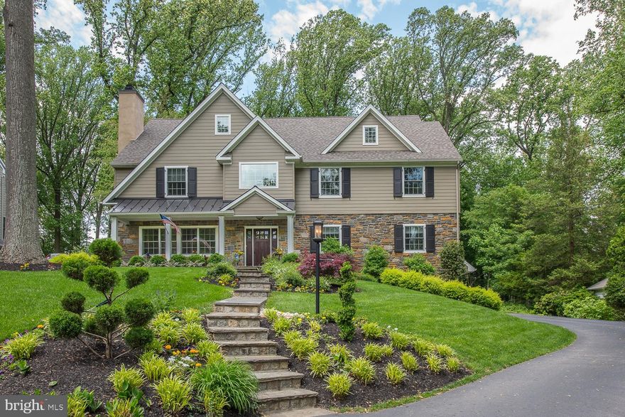 This spectacular Stone and Hardie Plank Colonial in Tredyffrin-Easttown School District on a lovely cul-de-sac street in Wayne was completely renovated in 2015 by Custom Builder, Sposato Homes, into a 6 bedroom, 5 full and two half bath light filled home with a wonderful open floor plan perfect for todays lifestyle. A flagstone front path, flanked with professional landscaping, leads to a charming front porch with standing seam metal roof. Enter into the foyer with two story staircase feature, gleaming rich brown site finished hardwood floors, custom wainscoting, 7 1/2" baseboards and deep crown molding that continues up two flights of stairs and into the Living Room and Dining Room. The Living Room has custom built-in cabinetry and shelving surrounding the stone wood burning fireplace with slate hearth.The dining room has two stunning 5 light chandeliers and a view of the private rear property. The beautiful hardwood flooring continues into the Butler's Pantry with sink, wine refrigerator and glass front lit cabinets. Continue into a dream Kitchen; oversized island with seating for four,  inset soft close cabinets, quartz countertops, Thermador stainless appliances including 6 burner gas cooktop with pot filler, a stainless farmhouse sink with air touch faucet, Sharp drawer microwave and two pantry closets. A breakfast room with sliding doors to the patio and family room with gas fireplace, wood mantel and coffered ceiling feature provide plenty of room for family and entertaining. A study with glass doors completes this floor. The second floor includes a wonderful Master Bedroom retreat with hardwood floors, tray ceiling, an outfitted walk in closet with granite topped island and an oversized Master Bathroom with radiant heat floors, a freestanding tub, oversized shower, double sink quartz top vanity and private water closet. Three additional bedrooms all with private baths, laundry room, linen closet and back staircase complete this level.  Hardwood staircase with white risers and wainscoting continue to the third floor with two additional bedrooms with walk in closets and a hall bath with walk in shower and double sink granite top vanity. The finished lower level offers another family room with shiplap feature wall as well as a powder room, mud room and access to the two car garage. The rear yard is a private retreat with large flagstone patio, a stone fire pit, lush lawn and beautiful mature trees. Other features: two HVAC systems provide dual zone heat and manabloc water system. Recent Updates: custom window coverings throughout, built in cabinetry and shelving in living room, basement finished, closet systems installed in 4 bedrooms,  regraded rear property, added flagstone patio and fire pit.