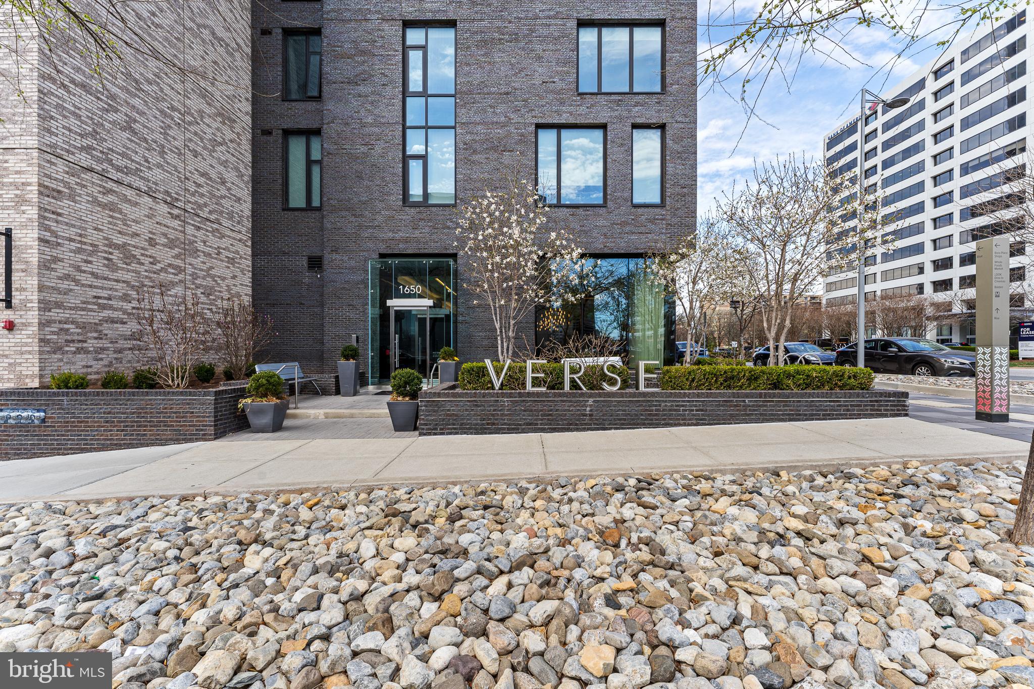 Welcome to Luxury condo living at the Verse. This one bedroom, one bathroom home is the perfect amount of space on the 17th floor. Beautiful floors, a sleek Gourmet kitchen with high end appliances with cabinet front panels, quartz countertops and plenty of space to entertain. Tons of natural light soak the condo with floor to ceiling windows. The primary bedroom is large but cozy & offers a walk-in closet. Soak in the tub or shower in the serene bathroom, with great lighting. A full size washer/dryer with storage round out this perfectly put together home. When outside the condo enjoy all the amazing amenities the Verse has as well as the Urban neighborhood, The Boro. Secure building with garage parking & Concierge, mail room with Amazon Hub, luxury common lounges like no other in any condo buildings around, tons of outdoor space with grills or areas to just relax. The pet shower will save your back and the need to clean up your bathroom after this task. The gym is massive with all the equipment you will need to cancel your current gym membership. Also, a roof top pool which opens in a few months! The Boro features the LOOK movie theater which also serves up great food and drinks, CIRCA, WHOLE FOODS, FLOWER CHILD, NORTH ITALIA, BLUESTONE LANE, EL BEBE, FISH TACO, AND GENJI IZAKAYA to name a few favorite eats. All the conveniences right outside your door but if you need more you are less than a half mile to Tysons I & the Galleria, Greensboro Metro, Leesburg Pike, Dulles Toll rd., 495 and 66! Welcome & Enjoy!