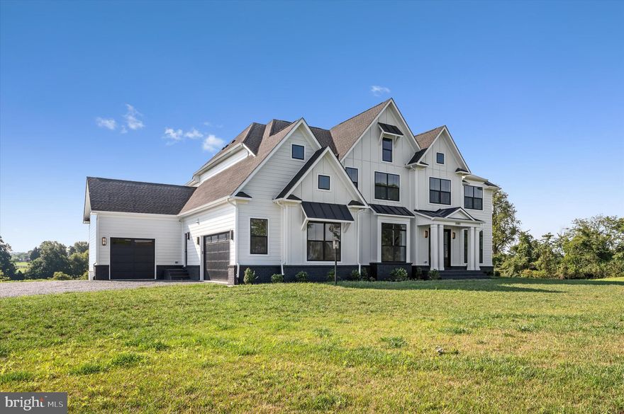 Welcome to this breathtaking custom 1 year young Carrington Home, perfectly positioned on a scenic 15 acre lot in the vibrant heart of Western Loudoun County. This luxurious modern farm house combines serene living with the ultimate in convenience and style. The home boasts six generously sized bedrooms each with a custom private bathroom, finished basement, and a main level that is tailored for contemporary lifestyles and grand-scale entertaining.

Upon entering, you are greeted by a gourmet kitchen, the true centerpiece of the home. It is equipped with state-of-the-art GE Cafe appliances, an elegant waterfall quartz island, and towering cabinetry reaching up to the impressive 10-foot ceiling. The kitchen is not only visually stunning but also exceptionally functional. Adjacent to the kitchen, the butler’s pantry features its own refrigerator, ideal for setting up a coffee bar, and an extra-large walk-in pantry with custom shelving ensures plentiful storage. The nearby mudroom offers a practical solution for daily essentials and a second staircase leading directly up to the primary suite.

The main level shines with an open-concept living area, accentuated by sophisticated wooden beams overhead and a great room that expands into a vast screened-in porch via a collapsible sliding glass door. This setup allows for seamless indoor-outdoor enjoyment, perfect for cozy evenings by the fireplace or hosting lively gatherings. A main-level bedroom with an attached full bath provides utmost convenience for guests or multi-generational living arrangements, while the private office with glass doors ensures a bright yet secluded workspace.

Every bedroom in this home serves as a private oasis, each featuring an ensuite bathroom and walk-in closet. The primary suite stands out as a haven of relaxation, complete with a custom-built closet and a spa-like bathroom that includes a soaking tub, double-headed shower, separate vanities, and a private water closet. An upper-level laundry room enhances the practicality of the home’s thoughtful layout.

The daylight basement opens out to a potential pool and patio area, promising endless possibilities for summer entertainment. The expansive yard not only provides a lush green space but also offers private access to the WO&D trail, inviting you to enjoy walking, running, or biking directly from your backyard.

Nestled in the heart of Loudoun County’s wine country, this home is surrounded by opportunities for adventure and leisure, including local breweries, wineries, farmers' markets, antique shops, and outdoor activities such as hiking, fishing, and paddle boarding. Despite its tranquil rural setting, essential amenities are just a short drive away in Purcellville.

Experience the pinnacle of Western Loudoun County living in this extraordinary new home. A rare opportunity to embrace a life of luxury and peace in a stunning natural setting. Don’t miss your chance to claim this gem as your own!