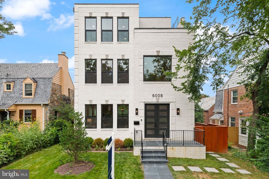 Welcome to 6008 34th Pl NW, an exceptional new home offering luxury, versatility, and a prime location in the sought-after Lafayette Park neighborhood. This spacious residence boasts seven full bedrooms and seven full bathrooms, including a separate one-bedroom, one-bath ADU unit above the garage with its own kitchen, washer, and dryer—making it ideal for guests, staff, or additional income. With stunning red oak hardwood floors throughout and modern finishes, the home is designed for upscale city living. An elevator provides effortless access to all four levels, and the rooftop deck above the primary suite offers panoramic views and outdoor entertaining options.

The first level features a culinary masterpiece kitchen with high-end finishes such as German-imported Leicht cabinets, quartz countertops, and premium Thermador appliances. Designed by Elite Kitchens, this open-concept space features soaring ceilings and seamlessly connects to the main living areas. A half bath adds convenience for residents and guests. On the second level, each bedroom is complete with its own en-suite bathroom, ensuring privacy and comfort, while a dedicated laundry room enhances practicality.

The top floor is dedicated to the luxurious primary suite, which serves as a tranquil retreat. It includes a private deck, two spacious walk-in closets, and a spa-inspired bathroom with a soak-in tub. A sleek wet bar completes this peaceful sanctuary. Outdoor living is equally impressive with a rooftop deck perfect for gatherings or relaxing escapes, as well as a private deck off the primary suite. The backyard offers open space, enclosed by a fence, with easy access to the garage parking below—providing ample outdoor space for outdoor activities and entertaining.

The finished basement features two bedrooms and two bathrooms, along with a large family room equipped with a wet bar, making it ideal for entertainment and relaxation. Parking is convenient with two interior spaces located below the ADU, providing ample room for residents and guests alike.

Located near Lafayette Park, residents enjoy access to Lafayette-Point-Park’s fenced playground, splash pad, basketball courts, shaded areas, and hiking trails of Rock Creek Park. Top-rated schools within walking distance include Lafayette Elementary, Deal Middle School, and Jackson-Reed High School. The vibrant neighborhood also offers nearby Chevy Chase shopping along Connecticut Avenue, featuring a variety of dining, retail, and entertainment options. 

Experience sophisticated city living with outdoor recreation and vibrant amenities at 6008 34th Pl NW—your ideal home in Lafayette Park.
