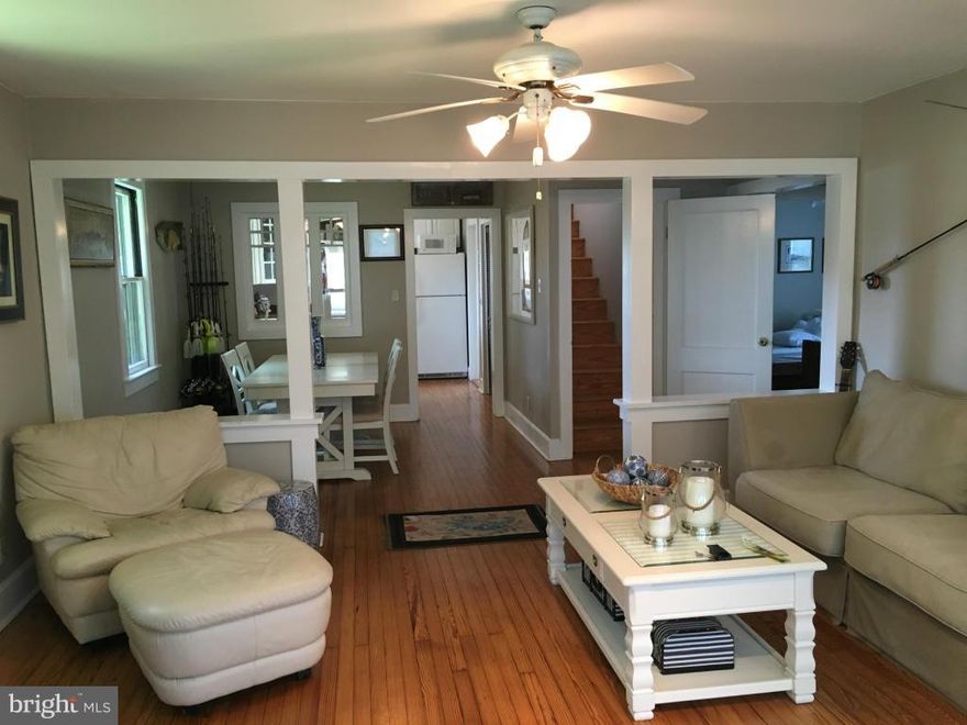 You HAVE to see the inside!!! Renovated & updated w/ hardwood flooring throughout, 2nd fl. master suite w/ sitting room & en-suite bath, bonus four-season room, 2 stoves for supplemental heat (1 wood & 1 pellet), perfect nautical details, hot & cold plumbing for an outdoor shower, water & electric to the backyard for gardening, storage shed for water toys! Bike/walk to everything!