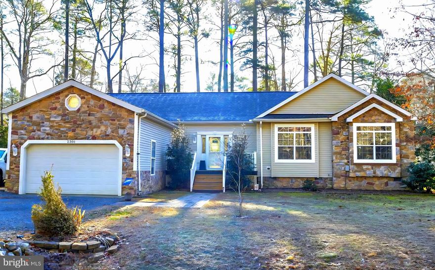 Beautiful ranch style home located on a double lot! 3 bedroom 2.5 bath with hardwood flooring... a double-sided fireplace divides the living room and kitchen! Kitchen island, modern appliances with gas stove, large dining room, laundry/ mud room, screened porch and deck, and lighted fire pit area... 2 car garage and large driveway for all your toys! Plus reverse osmosis water system!