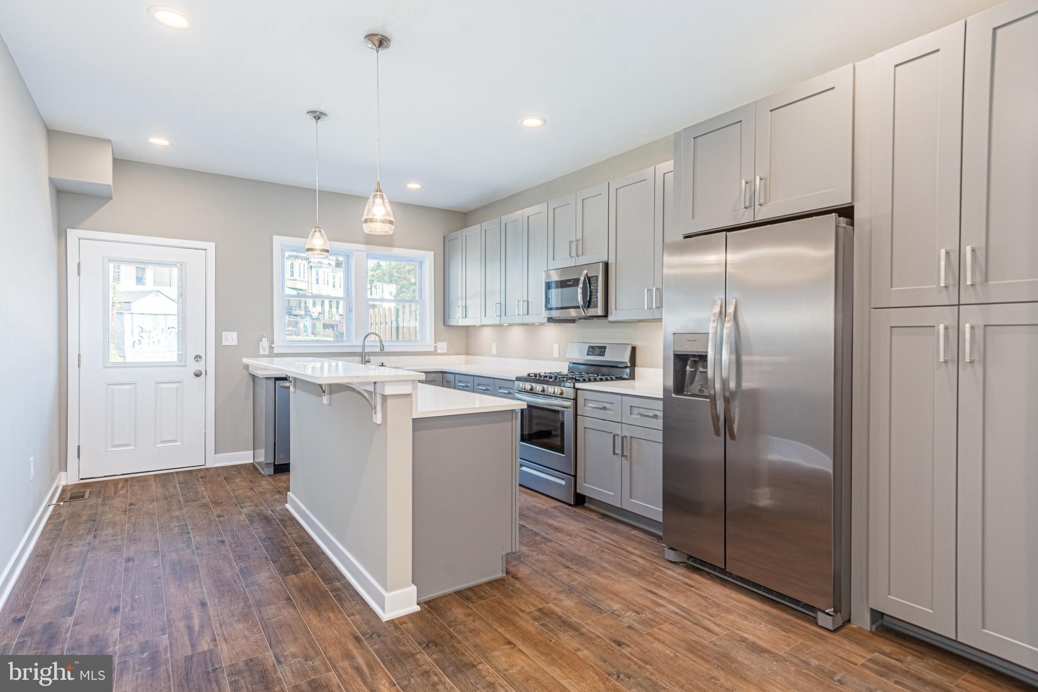 INTRODUCING UPTON GATEWAY - MAKE HOME OWNERSHIP A REALITY! 38 LUXURY RENOVATIONS WITH TONS OF BUYING INCENTIVES THAT MAKE OWNING A HOME MORE AFFORDABLE THAN RENTING! Standard features include 3 finished levels, wood floors throughout the main level and hallways, carpet in bedrooms, kitchens with 42" cabinets, Frigidaire ss appliance package, and granite counters. Main level with an open floor plan featuring a spacious living room, separate dining area, and kitchen, upper level Primary bedroom suite with full bath and walk-in closet and a 2nd bedroom with a hall bath and bedroom level laundry, 3rd level with 3rd bedroom and a family room, and 2 car off street parking! Tons of buying incentives including 10K Vacants to Values grant, 25K Live Near You Worship Grant, and a $2,500 lender credit when you use the preferred lender! Pictures are of a finished home in Upton Gateway