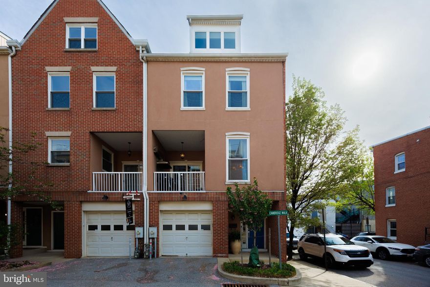 Welcome to 2331 Cambridge Walk, where sleek design, skyline views, and city energy collide. Nestled in one of Baltimore’s most walkable neighborhoods, this 4-level luxury Canton townhome is the definition of upscale urban living.
Your tour starts on the main level which has a huge enviable tandem 2 car garage with plenty of room for storage. The first of 4 bedrooms with an en-suite is located here. 
Next level up, the heart of the house is where you will find the Chef-inspired kitchen featuring granite countertops, stainless steel appliances, large island  and custom cabinetry—perfectly designed for both entertaining and everyday living. A separate dining room and a light filled living room. 
Keep ascending to the bedroom area Many feature include vaulted ceilings, spa-inspired en-suite, and serious closet space. Whether it’s guests, an au pair, or a home office—you’ll find a space for everyone here.
A new roof was installed in 2024. A new central HVAC air handler and furnace was installed in 2024. The upper and lower balcony were resurfaced in 2021. A new mini split air conditioner was installed on the top floor in 2019. YES, all the extra beverage fridges convey too. 
But the crown jewel? The rooftop.
We're talking jaw-dropping, 180° view rooftop terrace—Sip your morning coffee above the city or host unforgettable evenings under the stars with the skyline as your backdrop.
And it doesn’t stop there - Upper-level laundry room . Low monthly HOA fee—a rare find in a luxury city home
Just steps to Patterson Park, Canton Square, Fells Point, and the Inner Harbor promenade—Cambridge Walk puts the best of Baltimore right at your doorstep. Waterfront picnics? Night out at the square? Easy commute to I-95? You’re covered.