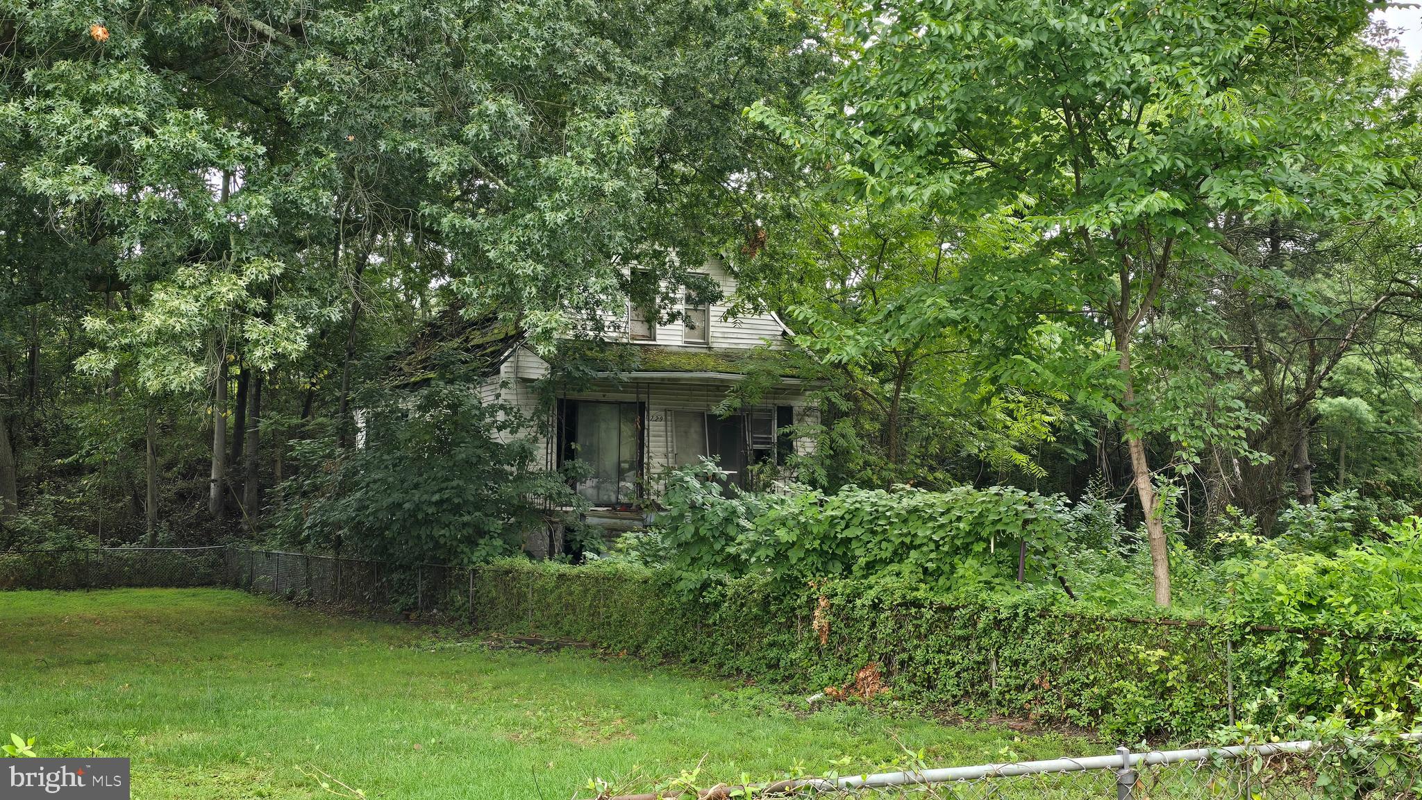 This property located on a large private level wooded lot on a quiet street presents a compelling opportunity for investors or renovators ready to tackle a significant project or tear down and build your dream home. Priced at $22,000 and sold as-is, it requires substantial rehabilitation. Please note, access to the property is currently restricted, so prospective buyers will need to plan alternative methods for site assessment. ****** In addition to this property, there is an option to purchase a package deal that includes several other properties in the area. This package deal could provide a strategic advantage for those looking to expand their investment portfolio or undertake a larger-scale renovation project. ****** Ideal for cash buyers or those utilizing hard money loans, this listing offers the chance to transform a fixer-upper into a valuable asset or tear down and build the home of your dreams. Seize this opportunity to invest in a property with great potential and explore the benefits of acquiring multiple properties through the package deal.