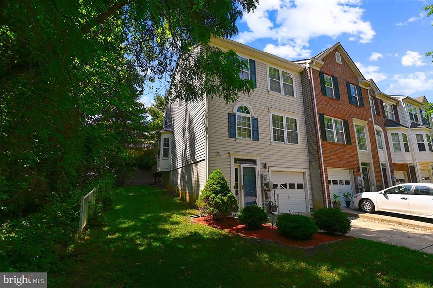 Check Out This Beautiful New Town End Unit!  3BR/2.2 BA with 3 finished levels, one car garage, large rear deck located on a cul-de-sac and backs to woods!  Spacious Primary Bedroom and  En Suite bath, soaking tub, shower and double vanity.  Lower level family room  with gas fireplace and halt bath  Updates include hardwood flooring in living room and lower level, Updated kitchen with stainless steel appliances including an excellent 5 burner gas stove, granite counters, soft close  drawers, and huge island with seating.  Don't Miss Your Opportunity To Own The Great Home!!!