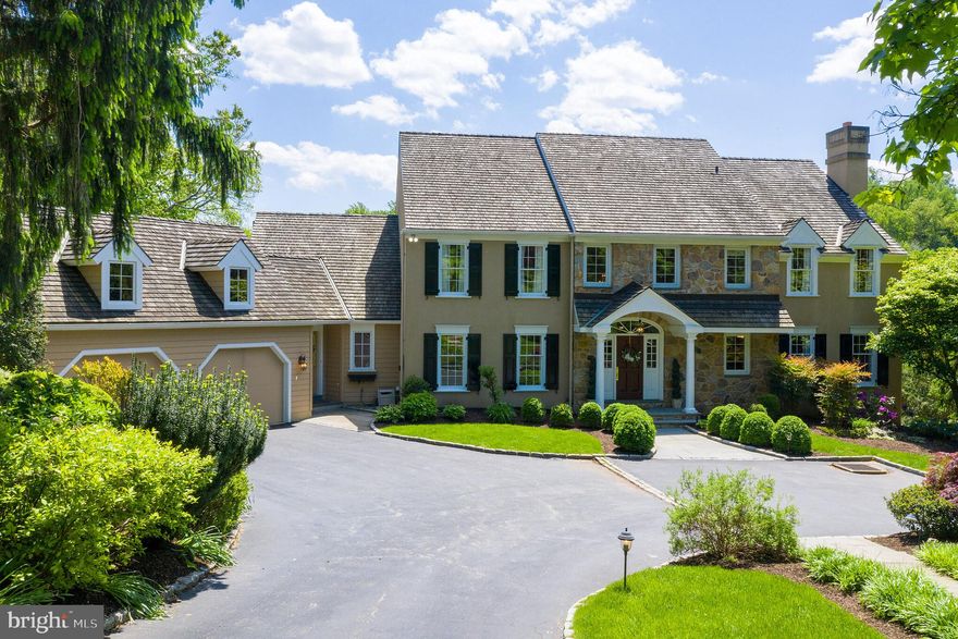 Welcome to 312 Julip Run! This exquisite property sits on a premier lot over looking magnificent views of bucolic lush landscape and ponds in the sought after development of Ravenscliff. Unlike any other property in the development, this home was completely renovated in 2002 by Architect Michael Visich with Sexton Builders, Pebble Pools & Gaffney Landscaping. Inside offers more than 6200 interior sq. ft. with custom features including extensive custom millwork, red oak flooring, recessed lighting, TV/music surround sound on 1st floor and lower levels, separate HVAC system for each of the three levels with gas hot air and A/C (2 levels upgraded in 2015). The foyer features a stunning two-story side-sweeping staircase with incredible views beyond the formal living room with French doors and gorgeous fireplace. The dining room is grand with custom moldings and large windows. The expanded chef's kitchen features beautiful wood cabinetry, a Subzero fridge, Thermador gas cooktop, dual ovens, island, and sun filled breakfast room overlooking rolling hills and sky. Beyond the kitchen is the family/great room featuring a dramatic vaulted ceiling with wood burning fireplace, incredible window views, built-in book shelves and rear door access to back yard deck and patios. There are two powder rooms on this level, one off the large mudroom that leads you to the oversized two-car garage and separate laundry room area with sink and cabinetry. The other powder room is off the foyer on your way to the library room with more built-ins and fireplace surround and just beyond a first floor office area with a wall of windows overlooking the inspiring view like no other! In total, there are three wood burning fireplaces found on this level all with custom mantels and beautiful hearths. Upstairs, find a master bedroom suite with tray ceiling and a large master bath with jetted tub and glass shower, dual sinks and makeup counter. There are his/her separate walk-in closets with plenty of room for all season wear! Down the hall, find three generously sized bedrooms that share a hall bath with granite sink and another whirlpool tub/shower combo.The lower level is fully finished and walks out to a rear yard private oasis. On the lower level, find the 5th bedroom and full bath. This is perfect spot for the in-law/au pair suite away from the 2ndflr. family living quarters. Down on this level, there is another media/family room with surround sound and daylight windows. Additionally, find a large gathering area with two game tables to play both a game of pool or Ping Pong or just relax and watch along side a full kitchenette including fridge, dishwasher, microwave, sink and cabinets. The rear yard is fenced-in surrounding the pool/hot tub with cascading water feature and stone wall. The entire property offers an extensive home exterior lighting package and landscape irrigation system. This home is perfect for today's buyer looking for a peaceful Main Line oasis just moments from downtown Wayne, Willows Park, Aronimink Golf, EA & more!