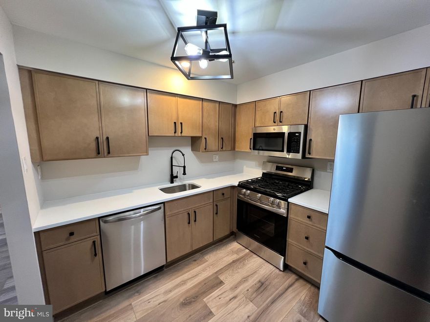 Welcome to this beautifully remodeled 2 bedroom, 1 bathroom first-floor condominium in the highly desirable Council Rock School District, located in Newtown, PA. The entire unit boasts new floors (2025), new kitchen cabinets and counter tops (2025), and kitchen appliances (2025).  This unit also comes with a new heating and cooling system, and hot water heater (2025).  The home is truly turn-key and ready for a wonderful owner looking for a beautiful place to call home.  Enjoy wonderful community amenities including a large swimming pool, recreation center, and recreational spaces for all ages (including newly updated Pickle Ball courts). Conveniently close to shopping, dining, parks, and commuter routes.