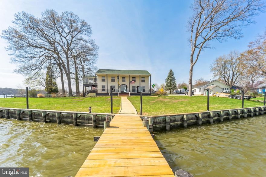 Auction Property. ONLINE AUCTION ONLY! In Cooperation with Alex Cooper Auctioneers. LIST PRICE IS OPENING BID AT THE ONLINE ONLY AUCTION.  Sale To Be Held On Auctioneer’s Website. Bidding begins Friday January 5, 2024 & ends Wednesday, January 10, 2024 @ 12:00 PM. Premier Waterfront Property, Located on a Perfect Point Lot, with Spectacular Views of Sue Creek which feeds directly into Middle River. The home includes 2,800± total square feet, 4 bedrooms, 4 full baths, and is situated on a private 0.36± acre waterfront lot. Perfect for a growing family or for those who simply want some extra space. As you enter the home, you'll notice the spacious living room with plenty of natural light, making it the perfect place to relax or entertain guests. The kitchen is equipped with modern Black Stainless Steel appliances and ample cabinet space, allowing for easy meal prep and storage. Gorgeous custom cabinets with Quartz Counter-tops. Large kitchen island, great for entertaining. The bedrooms are generously sized and offer plenty of closet space, while the bathrooms are updated and feature sleek finishes. The upper level offers a beautiful all season room with spectacular views of Sue Creek which feeds directly into Middle River and then to the Chesapeake Bay. Views of Baltimore Yacht Club and Red Eye Yacht Club. Outside, you'll find a large front yard that's perfect for barbecues, gardening, or simply enjoying the fresh air. Other outdoor features include brand new walkway to the dock with a new 10,000 pound boat lift. Automatic sliding gate for privacy. Don't miss out on the opportunity to make this house your dream home! Features Include a 324± linear feet of bulk head. Dock with two boat slips. New 10,000 pound boat lift. Brand new walkway to the dock Automatic sliding gate for privacy. Large front yard. Close proximity to Baltimore Yacht Club and Red Eye Yacht Club.