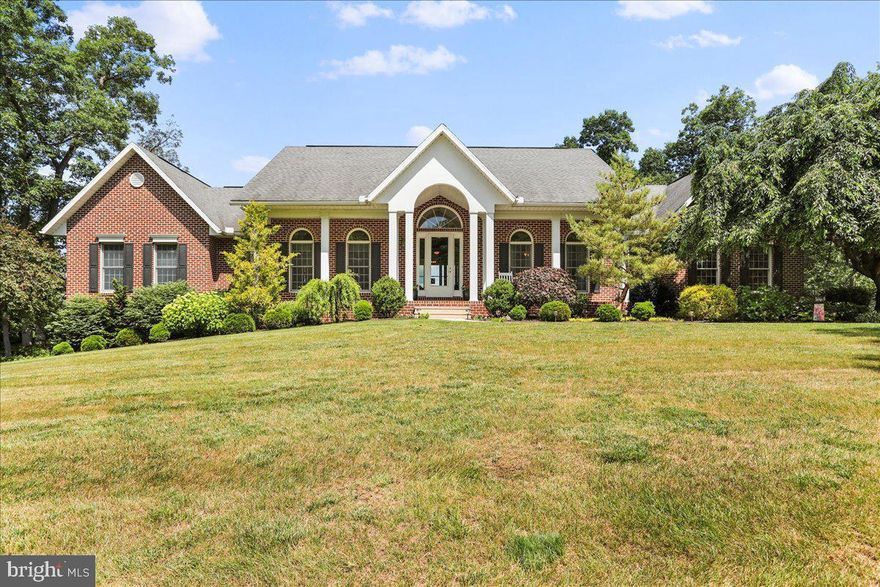 Luxurious custom-built home situated on over 2 acres on a quiet cul-de-sac. Beautiful, stunning views from your private deck overlooking Franklin County. This home offers four bedrooms, 3 full bathrooms and 2 half-baths. The living room features a gorgeous natural stone fireplace and custom cabinetry. Fully equipped kitchen features granite counter tops, stainless steel appliances with the dishwasher conveniently raised. Spacious formal dining room, breakfast nook and sunroom.  The lower level is almost entirely finished including a large family room with a propane fireplace, a kitchenette and a bedroom with ensuite. There are two garages - an upper level three-car garage and an oversized lower level two-car garage. Outside is a two-level deck and patio with beautiful views of the Conococheague Creek and sightings of wildlife.  A private haven but close to conveniences such as restaurants, groceries, shopping, Route 30, etc...