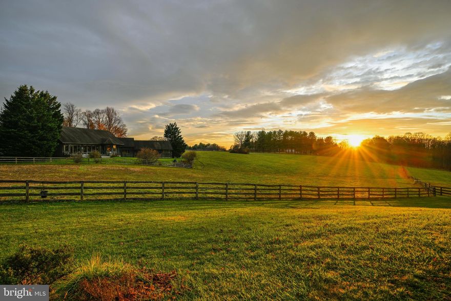 Live Authentically. Gunho Farm. A bit of big sky Montana in the heart of Baltimore County horse country.  A horse farm thoughtfully designed by a passionate and experienced equestrian.  A welcoming tree lined drive that elevates your sense of arrival every day. Revel in the alchemy of stone, wood, and glass. A textural symphony infused in this one of a kind organic contemporary. A home ahead of its time that exudes warmth and soul. The old patinaed beams provide a contrast that frame vistas from every gathering space. A first floor suite that celebrates the sunrise. Indulge in a soak with your horses in the distance.  Streamlined culinary spaces with an incredible sophisticated blue that will mesmerize your guests... The kitchen mirrors the peaceful sky beyond.  A powder room worthy of a magazine.  An extraordinary 10 stall barn with wash stall, feed room, hay room, tack room with washer/dryer and cubbies, and move-in ready apartment.  Additional 2 stall barn and tractor shed. Antique log cabin moved on site with stacked stone fireplace and glass.  A wonderful work from home or studio space.   Idyllic 22.6 acres of pasture in supreme location. Live your equestrian dream with easy access to everywhere you want to be.  Minutes to Four Corners, Hunt Valley and Towson. Cultivate your existence. The art of uniting human and home.