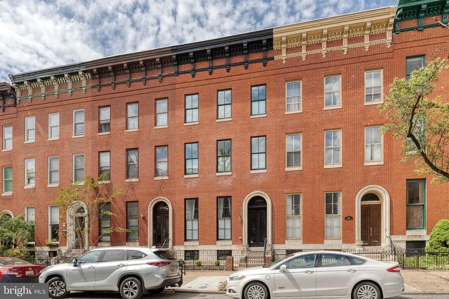 Exceptional Properties. Exceptional Clients. A rare opportunity is back - a stunning renovation of an architectural gem in Historic Reservoir Hill! Welcome to 2520 Madison Ave — a large gleaming town home in the heart of Baltimore’s vibrant Reservoir Hill neighborhood. This property has been meticulously redesigned from top to bottom by local architect, Calvin McCargo, Jr. of DesignHAND Architects. It is a true blend of historic charm with contemporary luxury. Step inside to discover a completely re-imagined interior featuring all-new systems from top to bottom, including a brand-new roof, CHAP approved windows throughout, and dual-zone HVAC for year-round comfort. Every inch of this home has been thoughtfully updated with modern finishes and high-end craftsmanship. This home offers more than a generous living space! Step inside and be wowed by soaring ceilings, and stylish finishes throughout. The open-concept layout is flooded with natural light, highlighting the sleek flooring, custom millwork, and designer touches throughout. The gourmet kitchen is a chef’s dream! The fully finished basement offers a flexible retreat with a custom wet bar — ideal for entertaining or relaxing. Upstairs, two full floors are dedicated to four spacious bedrooms and beautifully designed bathrooms, capped off by a stunning skylight that floods the top level with even more natural light. Enjoy the convenience of a private parking pad in the rear — a rare find in this area. Whether you're hosting guests or simply enjoying the tranquility of your beautifully updated home, 2520 Madison Ave is the perfect blend of style, function, and location. This home truly has it all: 4 full stories of living space, state-of-the-art mechanical systems, and thoughtful architectural details that set it apart. Nestled in the heart of historic Reservoir Hill, you're just minutes from Druid Hill Park, Penn Station, and everything downtown Baltimore has to offer. Don’t miss your chance to own this one-of-a-kind home in one of Baltimore’s most architecturally rich and quickly revitalizing neighborhoods.