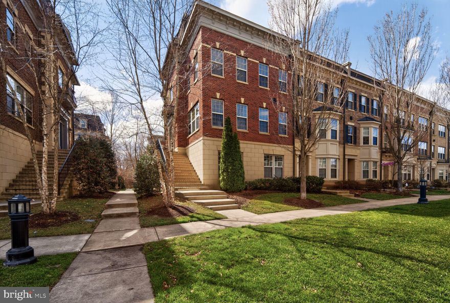 Discover refined living in this exceptional end of row Modern Brownstone townhome, ideally located in the sought after Potomac Overlook community near National Harbor. Built in 2013, this beautifully appointed residence offers 4 spacious bedrooms, 4.5 baths, and thoughtfully designed living spaces that blend sophistication, comfort, and functionality.
Step inside to a light filled interior featuring gleaming hardwood floors and high ceilings that create an airy, elegant ambiance throughout. The gourmet kitchen is a true showpiece—designed for both everyday living and entertaining with a large granite topped center island seating four, premium stainless steel appliances, a double oven, recessed lighting, and abundant cabinetry. The open concept kitchen and dining area flows seamlessly into the expansive living room, where walls of windows frame tranquil, park like views and a fireplace adds warmth and charm.
Each bedroom is generously sized and includes walk in closets, offering exceptional storage and privacy. The entry level bedroom provides flexible living options, ideal for guests, a private home office, or a fitness space. Upper level laundry adds everyday convenience.
Outdoor living is equally impressive, highlighted by a private roof deck terrace with a view of the Potomac River, perfect for morning coffee, evening relaxation, or entertaining under the stars. Situated in the middle of a large oval lawn common-area with thoughtful landscaping, sidewalks, and street lighting enhance the welcoming neighborhood feel. An oversized attached garage, additional guest parking, secure gated entry, and an integrated fire detection system offer both convenience and peace of mind. This residence delivers the perfect blend of upscale style, modern comfort, and an unbeatable location close to waterfront dining, shopping, and entertainment. An exceptional opportunity to own a sophisticated town-home sanctuary in one of National Harbor’s most desirable communities. Open SAT & SUN 1PM-3PM