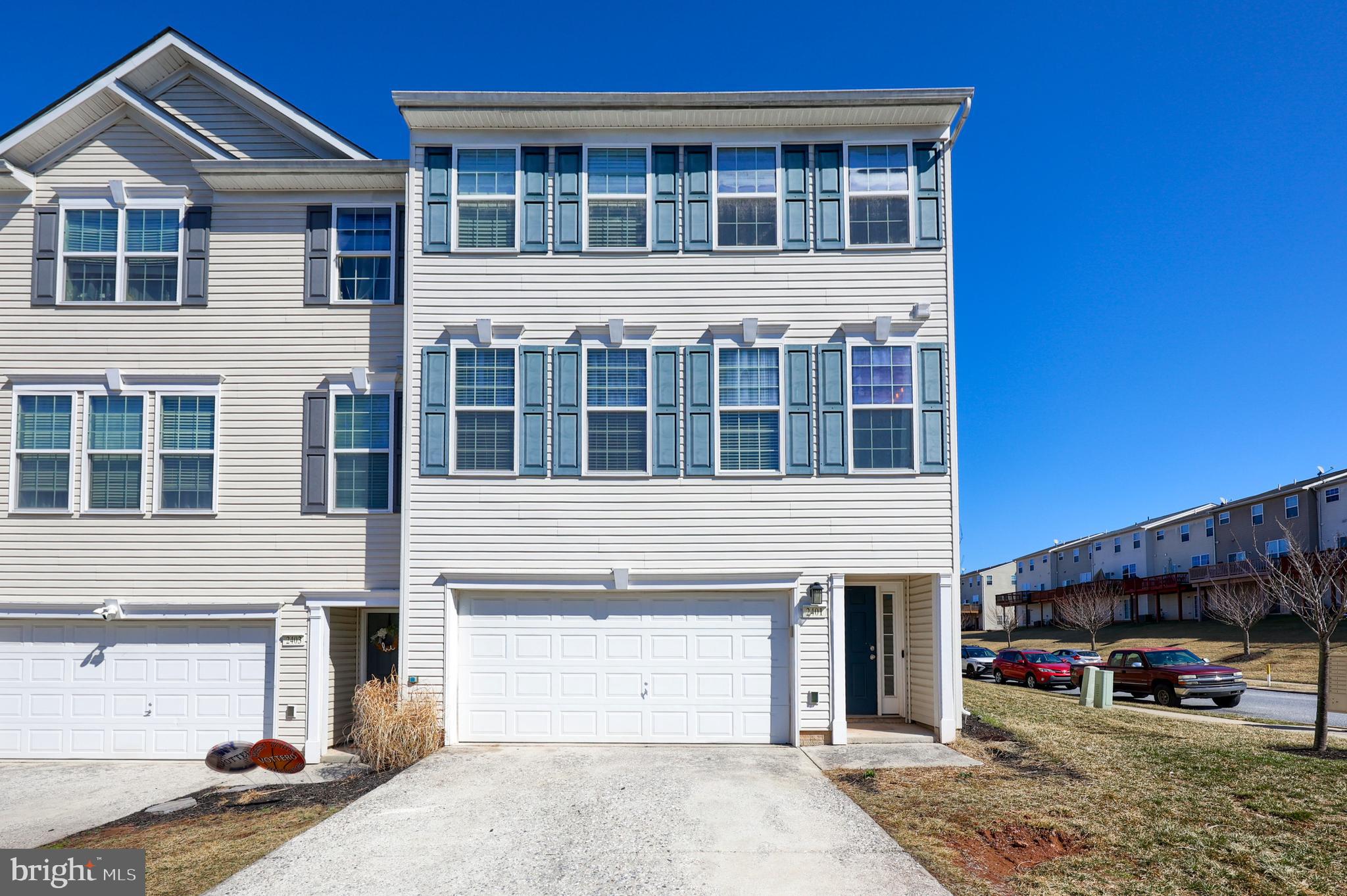 This move-in-ready end-unit home offers over 2,200 sq. ft. of finished living space! Enjoy maintenance-free living with lawn care and snow removal included. The fantastic outdoor area features a furnished, maintenance-free deck—perfect for relaxing. Inside, you’ll find numerous upgrades, including brand-new flooring throughout, a freshly painted interior, and beautiful butcher block kitchen countertops. The main level boasts an open, bright layout with luxury vinyl plank flooring, seamlessly connecting the living room, kitchen, and dining area. A convenient powder room is also on this level. Upstairs, the spacious primary suite offers a walk-in closet, an en-suite bathroom with a soaking tub, walk-in shower, and double vanity. Two additional bedrooms, a full guest bathroom, and a laundry room round out the upper floor. The lower level adds extra living space with a cozy family room and a half bath. Located close to parks, restaurants, shopping, and local amenities—this home is truly a must-see!
