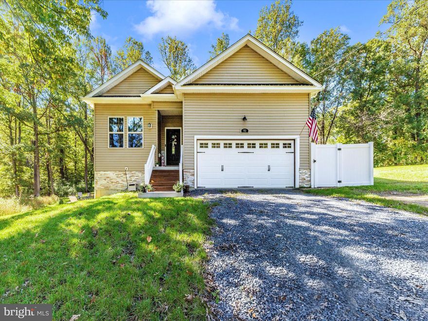Welcome to your dream home! This stunning 5-bedroom, 3-bathroom ranch offers a luxurious living experience with thoughtful design and high-end finishes. Step inside and be greeted by the open floor plan, where natural light floods the spacious living areas, creating a warm and inviting atmosphere. Luxury Vinyl Plank (LVP) flooring spans the entire house, combining elegance with durability and ease of maintenance. The main level features 3 generously sized bedrooms, 2 full bathrooms, a living room, a kitchen with granite countertops, stainless steel appliances, and sliding glass doors leading to a private deck and patio, perfect for outdoor entertaining.  Venture into the fully finished basement, one of the home's standout features. This expansive space includes 2 additional bedrooms and 1 full bathroom, offering a private retreat for guests or family members. The basement is thoughtfully designed with two distinct living areas, ideal for a home theater, game room, or home office. Abundant natural light streams in through large windows, giving the space a bright and airy feel, unlike typical basements. The sliding doors from the basement lead to another large patio for entertaining.
Furthermore, the high ceilings in the garage provide extra storage options, ensuring a clutter-free home.  There is community access to the river. Imagine spending your weekends fishing, kayaking, or just lounging by the water. It's the perfect way to enjoy the country life that this area has to offer.  Don't miss out on the opportunity to call this exceptional property your own!"  The seller is having the driveway paved.  PLEASE DO NOT TAKE SPRING LAKE LN, INSTEAD GO STRAIGHT ON KEY GAP RD AND TURN RIGHT ON LAUREL DR GO STRAIGHT AND TURN LEFT ON OLD SYCAMORE LN.