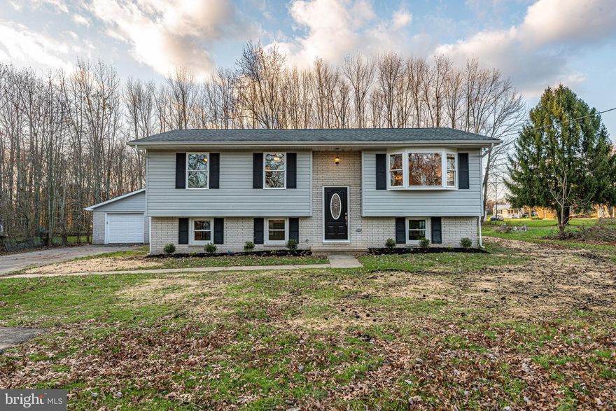 ONE OF A KIND! WOW! Check out this stunning renovation! Huge gourmet kitchen with large island, stainless steel appliances and quartz countertops, opens to great room with vaulted ceiling on main/upper level. 3 bedrooms, 2 full baths with custom tile. Lower level features another bedroom, full bath, recroom, and huge storage room. Outside is large level yard and oversized 3 car garage. This won't last long!