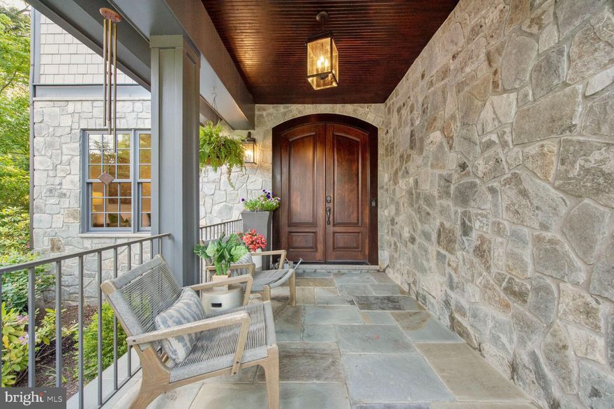 Welcome to 2311 N. Albemarle St., a beautiful home which shows "LIKE NEW" with nothing to do but move in and enjoy the summer! 
What a lovely entrance with the large covered porch and flagstone steps. The house offers an open floor plan with mahogany double doors that enter into the wide foyer. Views through the house to the rear grounds are seen from the entrance. The main level features  a large office which could easily become a bedroom. 
Both the mud room and powder room are perfectly placed.  The formal dining and living rooms are surrounded by  bright windows, tray ceilings and provide space for a large group.
The entire south side of the house features the gourmet kitchen and family room. Glass French doors lead out to the well landscaped grounds, flat and fully fenced.  The rear yard is  stunning and private and equipped with exotic mature plants and large patio for entertaining.  A BULL Gas grill and a Kamadojoe cooker/smoker are the icing o n the cake! There is a fire pit and overhead Bistro lighting for ambience.  Certainly, a perfect spot for relaxing or entertaining. The second level is exceptional with an oversized secondary bedroom perfect for multiple children or a wonderful play space.  The large laundry room features storage and space for folding and ironing.  The wide hallway allows for privacy between the bedrooms. Each bedroom has an en-suite bath. The primary bedroom  is lovely with a Juliette balcony, two oversized and private walk-in closets and an elegant bath.   The generously sized lower level features a  full bedroom and full bath.  There is a half-bath and wet bar with a beverage refrigerator.  The movie theatre or exercise room is generous in size and to add to the entertainment there is space for a wine room.  The whole house has been freshly painted and carpeted.  It is move-in ready and shows better then new! Pool table, grills  and TV convey. The school system is exceptional and the bus stop is directly in front of the house.