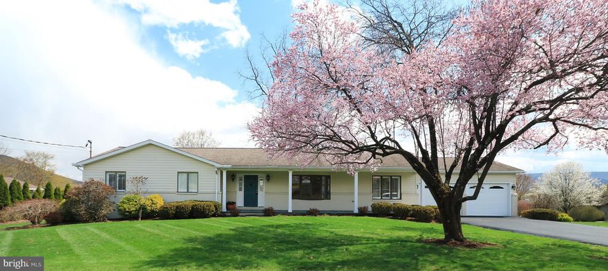 All Things Bright & Beautiful!  Welcome to a truly special home nestled in the desirable Centre Hills Village—a sprawling, light-filled ranch that exudes warmth, charm & custom craftsmanship throughout. Thoughtfully remodeled in 2009 by Ed Satalia Construction, this residence blends elegance with modern comfort.  From the moment you arrive, the eye-catching curb appeal draws you in with lush, mature landscaping & a newly added covered front porch that invites you to slow down & savor your surroundings. Step inside to discover stunning hardy plank flooring, soft neutral paint tones & an abundance of windows that bathe the interior in natural light.  The sun-drenched living room welcomes you with a lovely bay window & recessed lighting, creating the perfect space to relax or entertain. Just off the living room, the elegant formal dining room impresses with a full wall of custom built-ins, ideal for displaying treasured pieces or storing your entertaining essentials.  At the heart of the home is a gorgeous eat-in kitchen, where stainless steel appliances, alluring granite countertops, and handsome cabinetry set the tone. A generous island with a contrasting cabinet base, granite top & breakfast bar adds both function & flair. This space opens seamlessly into a cozy dining area with a stone propane fireplace & sliding glass doors that lead to the rear deck.  Out back, enjoy peaceful moments overlooking the scenic yard & stunning views of Mount Nittany, perfect for morning coffee or evening gatherings.  The serene owner’s suite offers a private retreat with three closets & a beautifully appointed full bath featuring a spacious vanity, tile flooring & a custom tile walk-in shower with glass doors. 2 additional bedrooms & a second full bath provide comfort & flexibility for family or guests.  A convenient laundry room off the kitchen includes the washer & dryer, access to the attached 2-car garage & a separate door leading to the backyard.  Additional highlights include a full unfinished basement ready for your vision, a heat pump with central A/C, a whole house generator & an RV hook-up in the garage.  Ideally located just moments from Centre Hills Country Club, downtown State College & Penn State University, with easy access to Routes 322 and I-99, this home offers the perfect blend of beauty, convenience & comfort.
