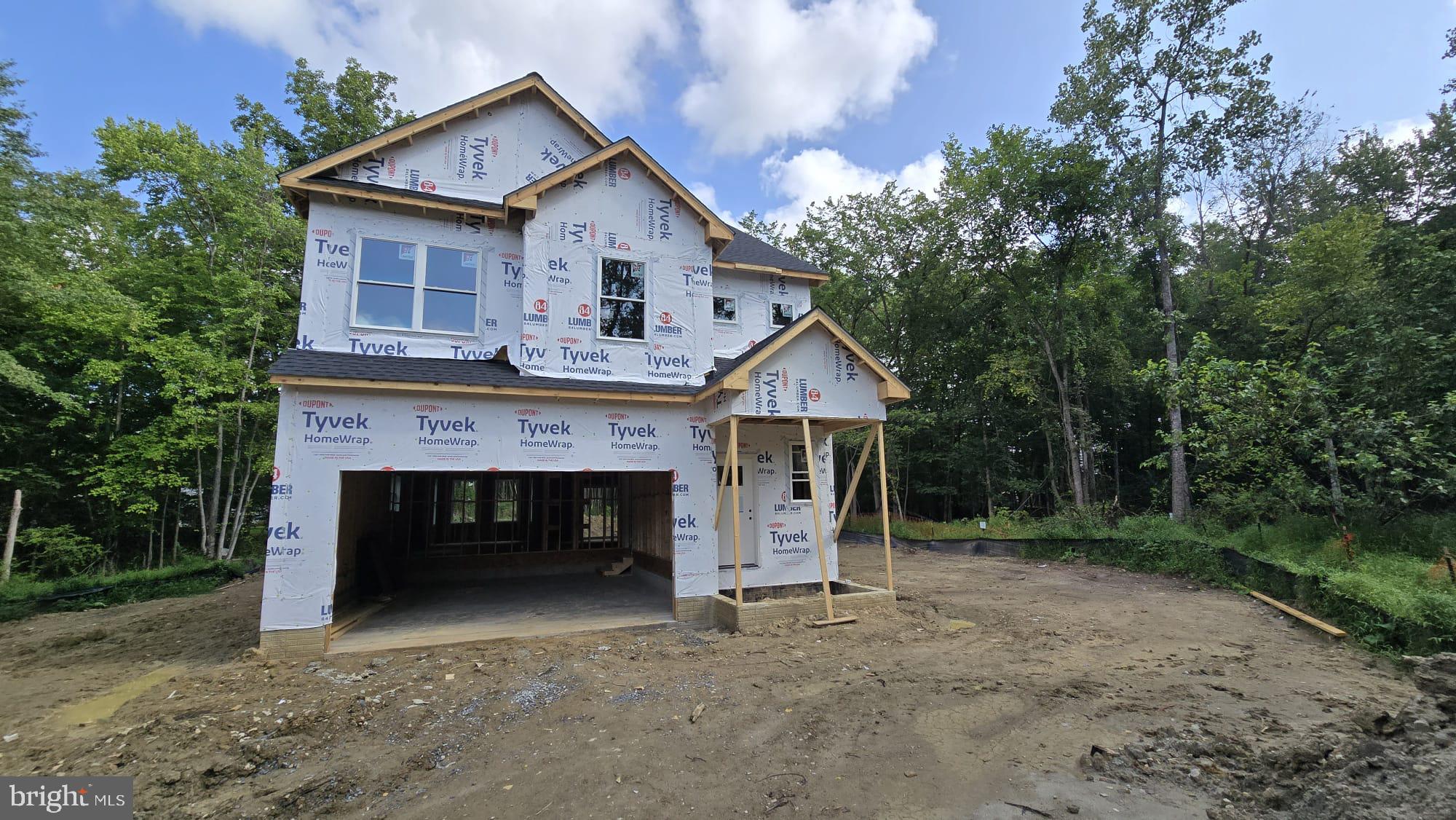To be built. Fall 2025 delivery. Photos are samples of same house built at other locations. Buyer to select finishes. Standard features include hardwood/LVP on first floor, bedroom level laundry, 9 ft ceilings 1st and 2nd floors, and gas fireplace to name a few. Primary bedroom with two walk in closets and en suite. Fully open main level great for entertaining. Finished basement with full bathroom included. Large wooded lot. No front foot or HOA fee.