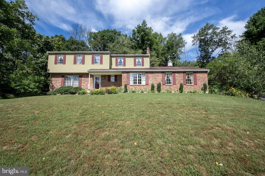 Nestled high above the Upper Perkiomen Valley on a highly sought after road, this 4 bedroom/2.5 bathroom colonial is a rare find! As you take the walkway to the front entrance, the wonderful views of the Upper Perkiomen Valley will not disappoint. The views are highlighted throughout the home as you will feel like you are in your own mountain paradise. One area that will be sure to impress is the custom woodwork throughout the home. Much of the shelves, built ins, crown molding, chair rails, and other wood items throughout the home were custom made. The attention to detail and pride in ownership throughout this home is something that is rare to find in today's real estate market. Enter inside the home and you will be welcomed by an open foyer with the formal living room off to the left. The living room opens to the formal dining room area, with ample space to seat a large gathering. The kitchen sits at the rear of the home and features a breakfast nook, glistening engineered hardwood floors, ample countertop /cabinet space, and a laundry closet. The family room is conveniently located off of the kitchen and provides a brick fireplace, access to the attached garage, and a sliding glass door leading to the rear patio. Completing the first floor is a powder room located off the center hall. Ascend up the stairs to the open second floor landing and be welcomed by 4 bedrooms and a full bathroom. The primary bedroom is large and offers a recently updated en suite bathroom and his and her closets. The three additional bedrooms are all generous in space and each have their own closets. The hall bathroom has a tub/shower combo and single sink vanity. The basement provides unlimited potential to be finished and used for whatever your needs may be, or just to use as an extensive storage area. The two car attached garage has plenty of room to park two vehicles and have a workshop space. At the rear of the home, the brick patio is the ideal location to enjoy afternoon shade and throw your favorite meal on the grill. Mature flower beds are located all around the home and will be a paradise for anybody with a "green thumb". The nearly two acres provides opportunity to be used however you may desire, but is also very manageable in terms of maintenance. A large shed sits on the side of the driveway and can be used for a wide range of needs. This home has been lovingly cared for during the many years of current ownership and is ready for the new owners to enjoy all that this home has to offer. Located near major routes 100, 29, 663, and the Northeast Extension of the PA Turnpike, this home will not last long. Set up your showing today before this opportunity is gone!