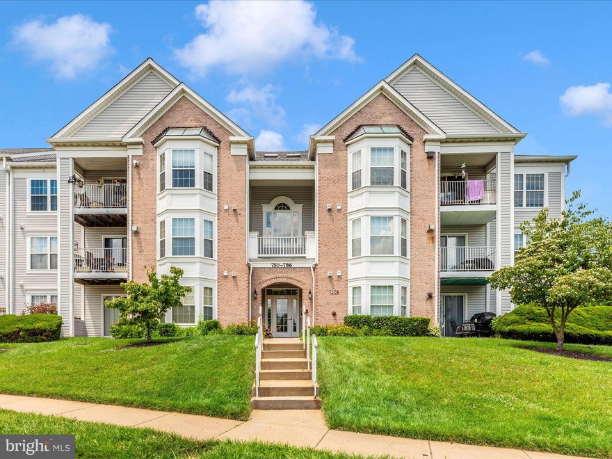 Rarely available main level condo that overlooks the woods in Timbergrove!  This one has all the features you want for easy condo living - secure entrance; main level with no stairs once inside the building; 2 large bedrooms each with connecting full bath and walk-in closet; kitchen that's open to the dining and living rooms with sliding door to balcony that overlooks the woods; full size washer and dryer; move-in-ready with fresh paint throughout; community pool/clubhouse and playground.   Updates include - laminate plank flooring; water heater replaced 2023; heating system replaced 2023; A/C replaced within past 5 years.   The Village of Timbergrove community has single family homes, townhouses and condominiums and has proximity to major roads and the Baltimore Beltway for easy access, The Village also has a Village Swim Club, playground, and clubhouse. Close to Nature Reserve, restaurants and shopping. This unit looks out to  woods that provides a peaceful view. Live in a condo that provides you with a sense of style at a reasonable price.