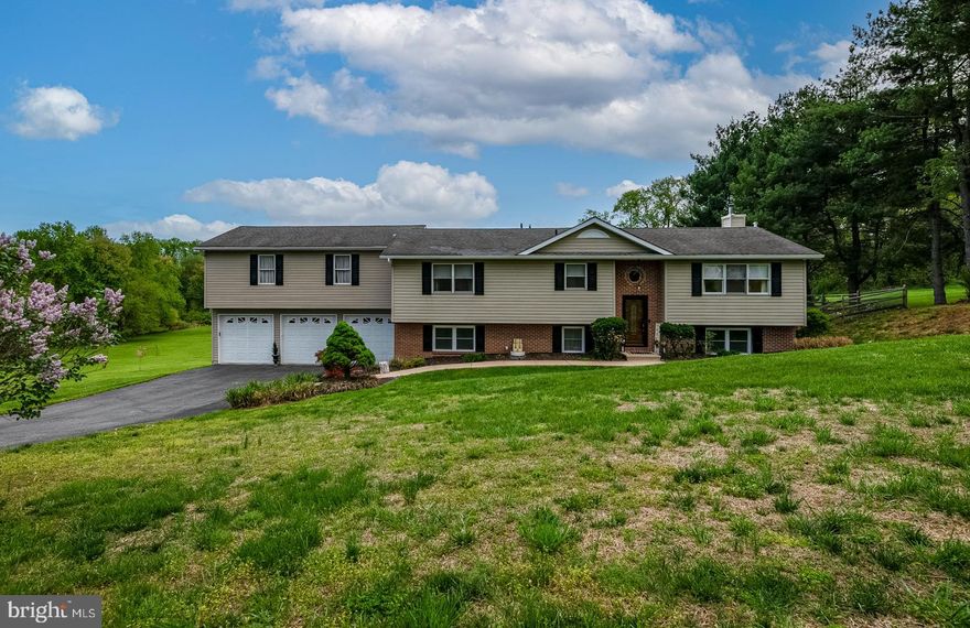 This Stunning, Updated Home sits on almost 2.5 Acres in the Water- Oriented community of Saint John's Manor. The gorgeous custom Kitchen features Granite tops, Stainless appliances, and under cabinet lighting. The Living Room & Dining area are open to the Kitchen and Sliders that lead to a New Oversized Deck with Covered Hot Tub. The Primary Bedroom is oversize and has His/Hers closets. The spacious hall bath has been beautifully renovated with Custom Double Vanity and Tile & Glass Shower. The second bedroom on this level has a Bath En-Suite. The Lower Level includes a Large Third Bedroom and Third Full Bathroom, Family Room with pellet stove and large mud room with laundry that accesses the original Garage. The owner added 3 more Garage Bays, (perfect for storage of water craft) with a large one bedroom In-Law Apartment above. Due to health reasons the apartment was not completed. However, several materials to complete the apartment are on site. The Park-Like setting invites you to enjoy outdoor activities on the deck and there is a cool Water Feature and Koi pond. A Fenced area & Shed round out the Back Yard.