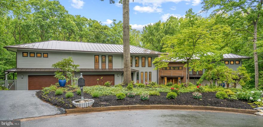 Welcome to 920 Woburn Court. This home is like none other. As you enter this stunning 9 bedroom, 10.5 bathroom home your attention will immediately be taken to the great room. Boasting 20+ foot tall ceilings the great room leads into what could be the best entertaining space in all of McLean. A massive wrap around deck surrounding the entire back of the home provides an indulgent extension to the entertaining space and perfectly accompanies the oversized kitchen, dining room, sun room, recreation room, pool room, and movie room which leads to the private outdoor pool. In addition to the abundant entertaining space, the home provides three separate spaces all with different uses. The guest wing offers not one, not two, but three fantastic bedrooms with private bathrooms, one of which includes an oversized corner master suit — perfect for a large group of guests to have their private space. The family wing boasts 4 bedrooms, laundry, a separate family room, and a stunning primary bedroom with floor to ceiling windows. You can then take the private elevator to the main level to access "the suite” — a fully separate 2 bedroom unit in the home, excellent for a live in Nanny or to have a separate dwelling for immediate family or other guests. This suite has both private interior and exterior access. If this isn't enough to catch your attention this newly constructed home's design will leave you breathless. The entire home is covered in a brand new metal roof, making it the only 10,000+ square foot home in McLean to have such a unique architectural feature. Designed and finished with the greatest of care one cannot fully appreciate this home's finishes unless seen in person.