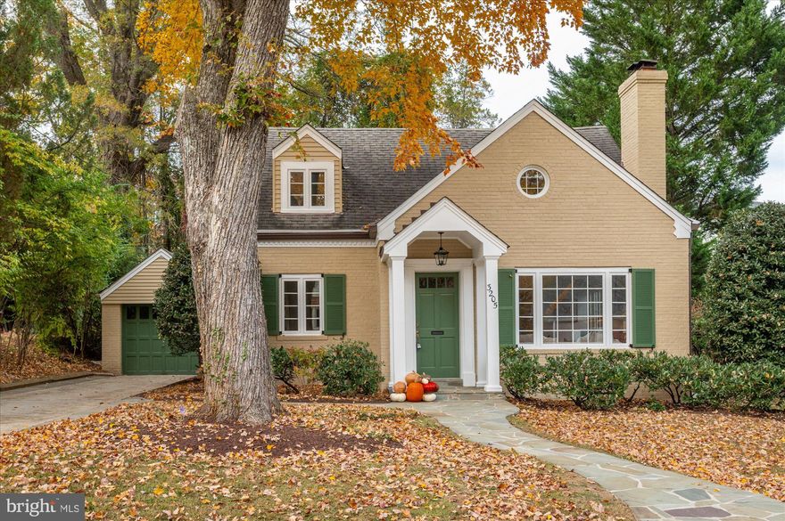 OPEN SATURDAY, 1-4. OPEN SUNDAY, 2-4.   Welcome to 3205 Cummings Lane! Nestled on one of Chevy Chase’s most picturesque streets, this beautifully updated cottage-style home offers the perfect balance of modern comfort and timeless charm. Don’t be fooled by its storybook façade — this move-in-ready gem is surprisingly spacious, with just under 3,000 square feet across three finished levels, three bedrooms, and two full baths. With its wonderful curb appeal — lush landscaping, mature trees, and a welcoming front walkway — this home immediately draws you in.  And the location couldn’t be better: just steps from Chevy Chase Park, the weekly farmer’s market, Brookville Market, La Ferme Restaurant, and all the neighborhood favorites on Brookville Road. Plus, it’s in-bounds for membership in the coveted CCRA Swim and Tennis Club. Inside, sunlight fills every corner. The refinished white oak floors and thoughtfully designed layout create a natural flow throughout. The main level welcomes you with a wide entry hall, complete with a coat closet, a bright living room featuring a wood-burning fireplace, and an elegant dining room that comfortably seats eight. The fully renovated kitchen features soft-close cabinetry, quartz countertops, a subway tile backsplash, recessed lighting, stainless steel appliances, and a newly added pantry closet. Just off the kitchen, a sun-splashed family room awaits — with vaulted ceilings, a second wood-burning fireplace, built-ins, two skylights, and French doors that open to a lovely backyard patio. Flooded with natural light and framed by greenery, it’s the perfect spot to relax or entertain. The main-floor bedroom includes a completely updated ensuite bath with a brand-new shower. Upstairs, the primary suite feels like a peaceful retreat, with a spacious closet and a cozy alcove that is a perfect space for a sitting area, nursery, or home office. A large second bedroom with two closets, and a beautifully updated hall bath, completes the upper level. The lower level offers exceptional versatility, featuring a newly carpeted recreation room, a bonus flex space with new luxury plank flooring (ideal for a gym or work room), plus a laundry room and utility area. Outside, you’ll find mature landscaping, a detached one-car garage, and a long driveway providing ample off-street parking. The back patio offers a private spot to unwind, surrounded by lush trees and a perennial garden. With its abundance of updates, bright, inviting living spaces, and an unbeatable location, 3205 Cummings Lane is everything you could want — a spacious yet cozy cottage with modern updates, wonderful curb appeal, and timeless Chevy Chase charm.