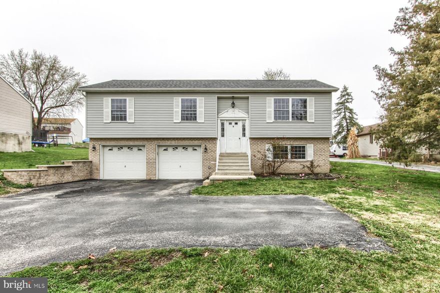 Welcome to your dream home in the highly sought-after Lake Meade community! This stunning 3-bedroom, 2.5-bath residence offers the perfect blend of modern comfort and lakeside living. Nestled within a private, gated neighborhood centered around a breathtaking 300-acre lake, this home provides access to an amenity-rich lifestyle that every family member will adore. From swimming, boating, and fishing to enjoying sports at the recreational areas or dining with friends at the marina, Lake Meade promises endless opportunities for creating cherished memories.  The house itself is a gem, featuring a spacious open-concept living room with soaring vaulted ceilings that create an airy, inviting atmosphere. The well-appointed kitchen boasts a large island, perfect for casual meals or entertaining guests. Step outside onto the expansive deck—ideal for relaxing or hosting summer barbecues—and enjoy the peace of mind that comes with a new roof (2024) and a recently updated HVAC system (2022) ensuring year-round comfort.  Upstairs, you’ll find three generously sized bedrooms and two full baths, offering ample space for family, guests, or a home office. The lower level adds even more versatility with a convenient half bath and a large room that could serve as a second living area, playroom, or whatever suits your needs. Complete with a 2-car garage, this home combines practicality with the joys of lakefront living. Don’t miss your chance to own a piece of paradise in Lake Meade—schedule your tour today!