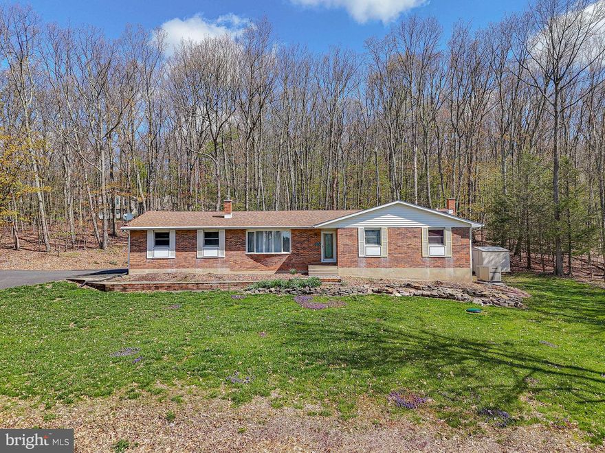 WELCOME HOME to this timeless ranch, thoughtfully enhanced with impressive upgrades and updates. Enjoy peace of mind with a newer HVAC system, roof, and whole-house generator. Step outside to a stunning oversized Trex deck - perfect for relaxing or entertaining - overlooking a private, wooded rear yard, all set on a beautiful one-acre lot.  Bonus screened in porch area.  Inside, you’ll find comfortably sized rooms, including a spacious primary suite with en suite bath. A separate laundry room with built-in cabinetry adds convenience and functionality. Great horseshoe driveway plus a two car garage. Basement is huge - and already partially finished and ready for your final touches. Yard offers a shed as well. Washer, dryer, fridge stay. Don't miss out on this solid home with so many hard to find improvements, make your appointment today!