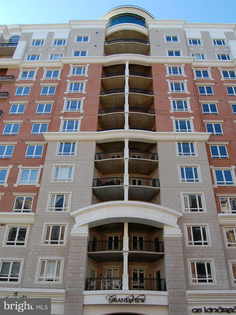 Rare opportunity for GrandView Penthouse Level living! 2BR/2BA Calais model w/2 parking spaces. Many upgrades including hardwood flooring, custom painting, window shades, appliances, light fixtures, backsplash & more! Top floor features include 12 tray ceilings, larger windows and open air, southern-exposure balcony with a top floor view! Original owner never rented. Must see custom decorating!