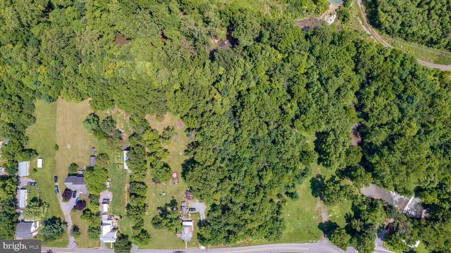 This picturesque property offers the perfect blend of privacy and tranquility, surrounded by trees with a nearby stream passing through, what an amazing location to build your dream home. Must see to appreciate! The expansive lot offers ample space for outdoor activities, making it ideal for those who love to entertain, garden, or simply enjoy the beauty of nature. This lot presents endless possibilities and is conveniently located near VA and Inwood.