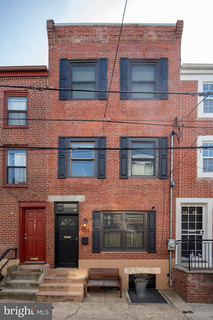 Welcome to this nicely renovated home with great charm and character throughout. This lovely home features 2 bedrooms, 2 baths, plus office or additional small bedroom, stainless steel appliances, wood beam ceilings, beautiful wood flooring, cozy exposed brick, contemporary marble and tile baths, central air, yard and basement. Nestled on a low traffic block, in prime, north end, Bella Vista! Located between Bainbridge and Fitzwater Streets, 8th and 9th. Convenient to two parks, Whole Foods, Italian Market, great restaurants, shopping, South Street, public transportation and more! Situated in the much sought after Meredith School Catchment.