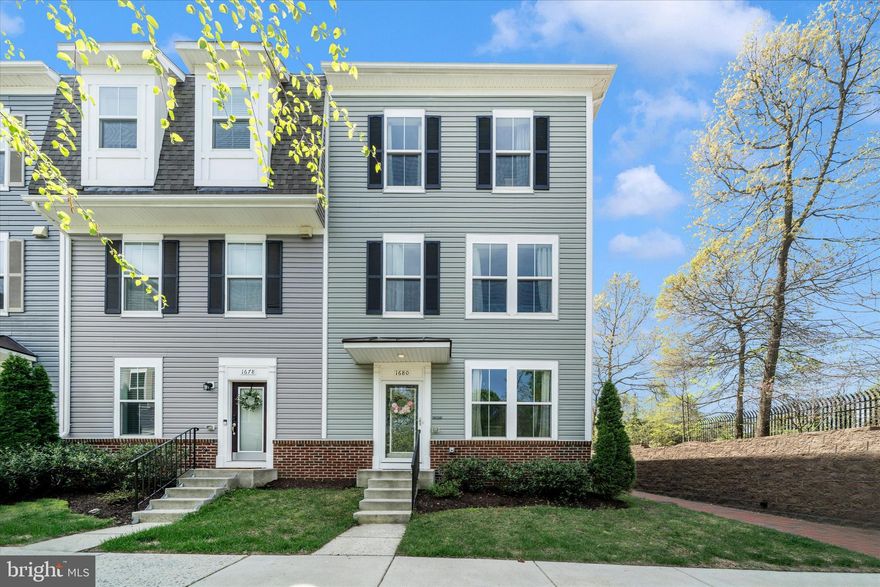 Welcome to sophisticated living in Odenton Station. This move-in ready end unit townhome blends style, space, and unbeatable accessibility in the heart of Historic Odenton. You’ll be steps from the MARC train—making commuting to Washington, D.C., Baltimore, and beyond effortless. 

This home delivers comfort, functionality, and flexibility for today’s lifestyle with 3 bedrooms, 3 full baths, 1 half bath, and 2,000 sq. ft. across three beautifully designed levels.

Enter on the first level which offers an incredibly versatile flex space—perfect for a game room, home office, gym, or whatever you dream for the space—plus a full bathroom and access to the 2-car garage. The driveway holds 2 cars. The electrical panel has been upgraded with a whole house surge protector for added peace of mind. Luxury vinyl plank flooring flows throughout the home for a cohesive, polished look.

The light-filled, open concept main level is an entertainer’s dream, featuring a spacious family room with a large ceiling fan, a dining area with great sight lines, and a stunning kitchen anchored by a granite island that seats six and a pantry. A convenient half bath and storage closet complete this level.

Upstairs, the large primary suite impresses with a walk-in closet, large ceiling fan, and an ensuite bathroom with a double vanity and contemporary finishes. Two additional bedrooms, a full hall bath with an open linen closet, and a third-floor laundry room just steps from the bedrooms add everyday ease.

Outdoor living shines with an oversized balcony (approx. 17ft x 9ft) that’s ideal for grilling, relaxing, or hosting friends. Additionally, Odenton Station maintains a serene, tree-lined neighborhood tot lot.

You’ll enjoy a lifestyle of exceptional convenience, with walkable access to the Odenton Regional Library and a community favorite—Food Truck Thursdays at the fire station.  There are seven nearby grocery options and an array of acclaimed local restaurants, shopping, and entertainment at the Waugh Chapel Towne Centre. Scenic walking paths and nearby hiking trails offer you a refreshing escape to unwind in nature, creating the perfect balance for elevated living. Plus, you are minutes from Fort Meade, Annapolis, Route 32, and I 97, keeping you connected to everything you need.