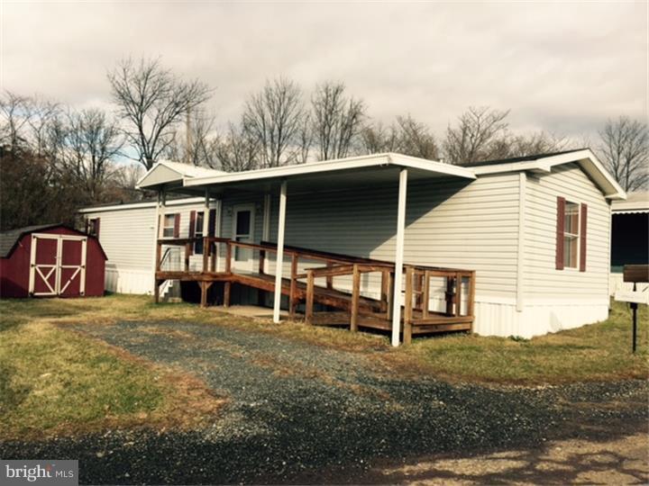 This is a quiet and well-managed mobile home park and the unit for sale is in a very convenient, easy-to- find location. A well-built ramp leads to the front door. Inside is a 3 BR, 2-bath home, clean and well-maintained. There are 2 average sized bedrooms and 1 small one which can also be a den or office; it features shelves and built-ins. There are 2 full baths, one at one end of the home and another full bath at the other end, and both bathrooms have skylights. The kitchen has wood cabinets and lots of counter space, and there is a dining area. All appliances remain. The furnace has been serviced and is in good condition. Closet space is excellent and the outside storage shed is well-constructed. Water softener remains, clothes washer is 3 years old. This is a Redman unit manufactured in 2000, and is a 14x70 single wide. Nothing to do but move in. This home is in very good condition throughout! Note: no dogs and no motorcycles are allowed in Bordic Park.